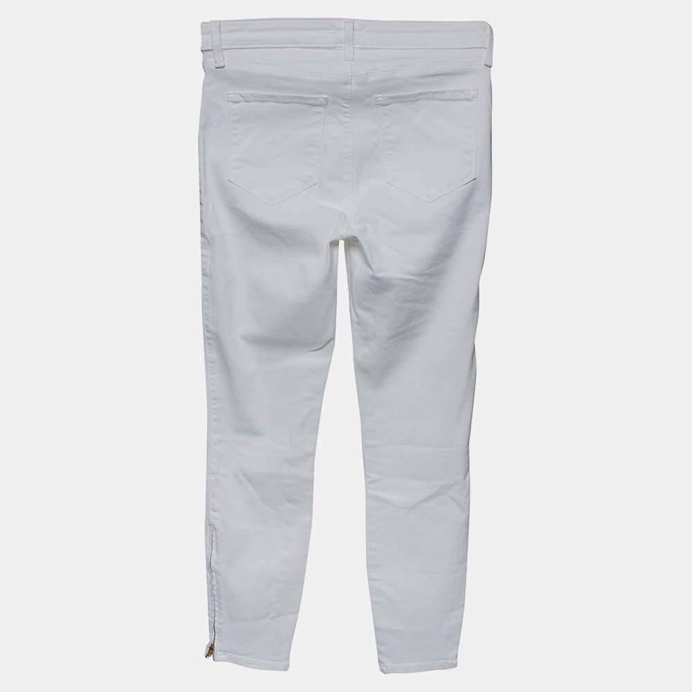 Cette paire de jeans blancs de la marque Lagence est conçue pour vous apporter style et confort. Elle a été cousue pour obtenir une forme skinny et est dotée d'une fermeture à glissière au niveau de l'ourlet. Associez le jean avec le haut de votre