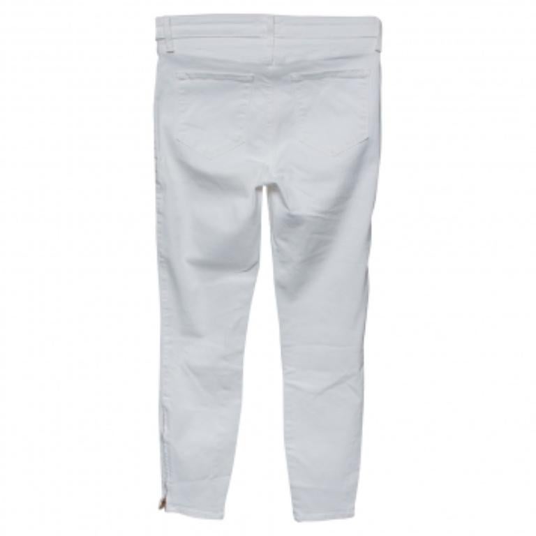 From L'agence comes this pair of white jeans tailored to give you style with comfort! It has been sewn to a skinny shape and designed with zip details towards the hem. Pair the jeans with any top of your choice and high heels or sneakers.