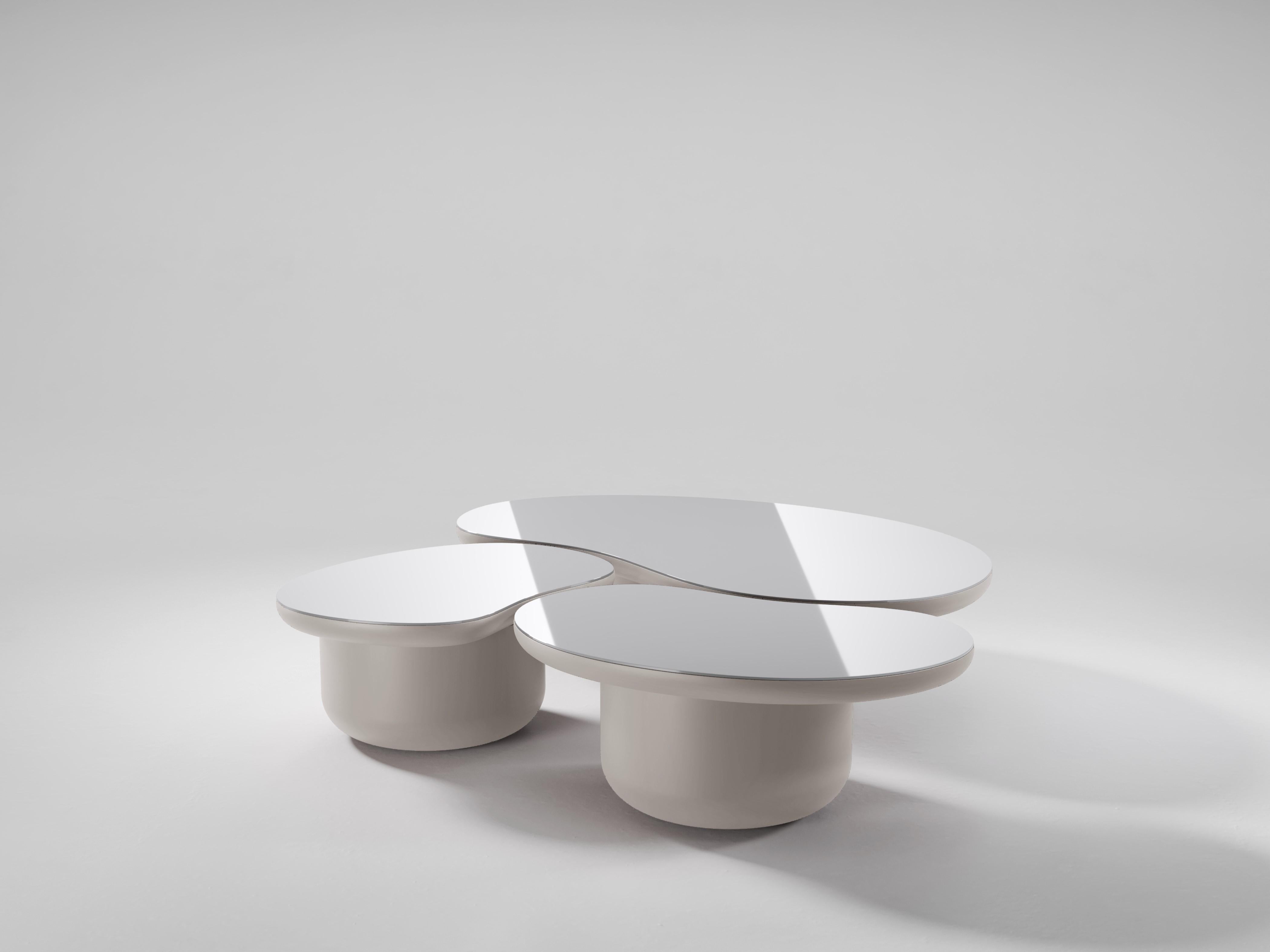 The Laghi coffee tables are a group of low coffee tables, each in the shape of a body of water and inspired by the peacefulness and beauty of the Lake District in United Kingdom. Each table is topped with a polished piece of aluminium to symbolise