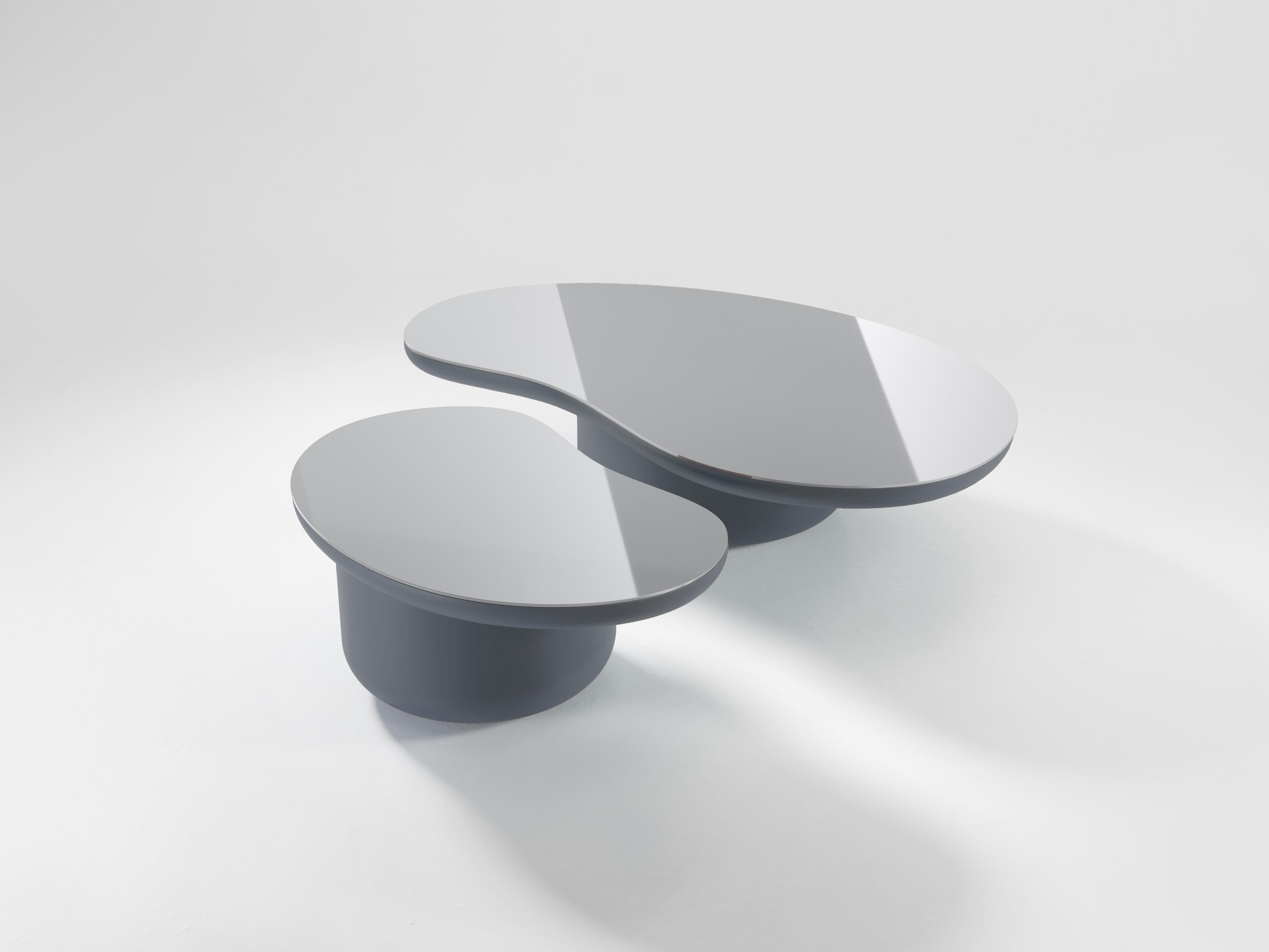 The Laghi coffee tables are a group of low coffee tables, each in the shape of a body of water and inspired by the peacefulness and beauty of the Lake District in United Kingdom. Each table is topped with a polished piece of aluminium to symbolise