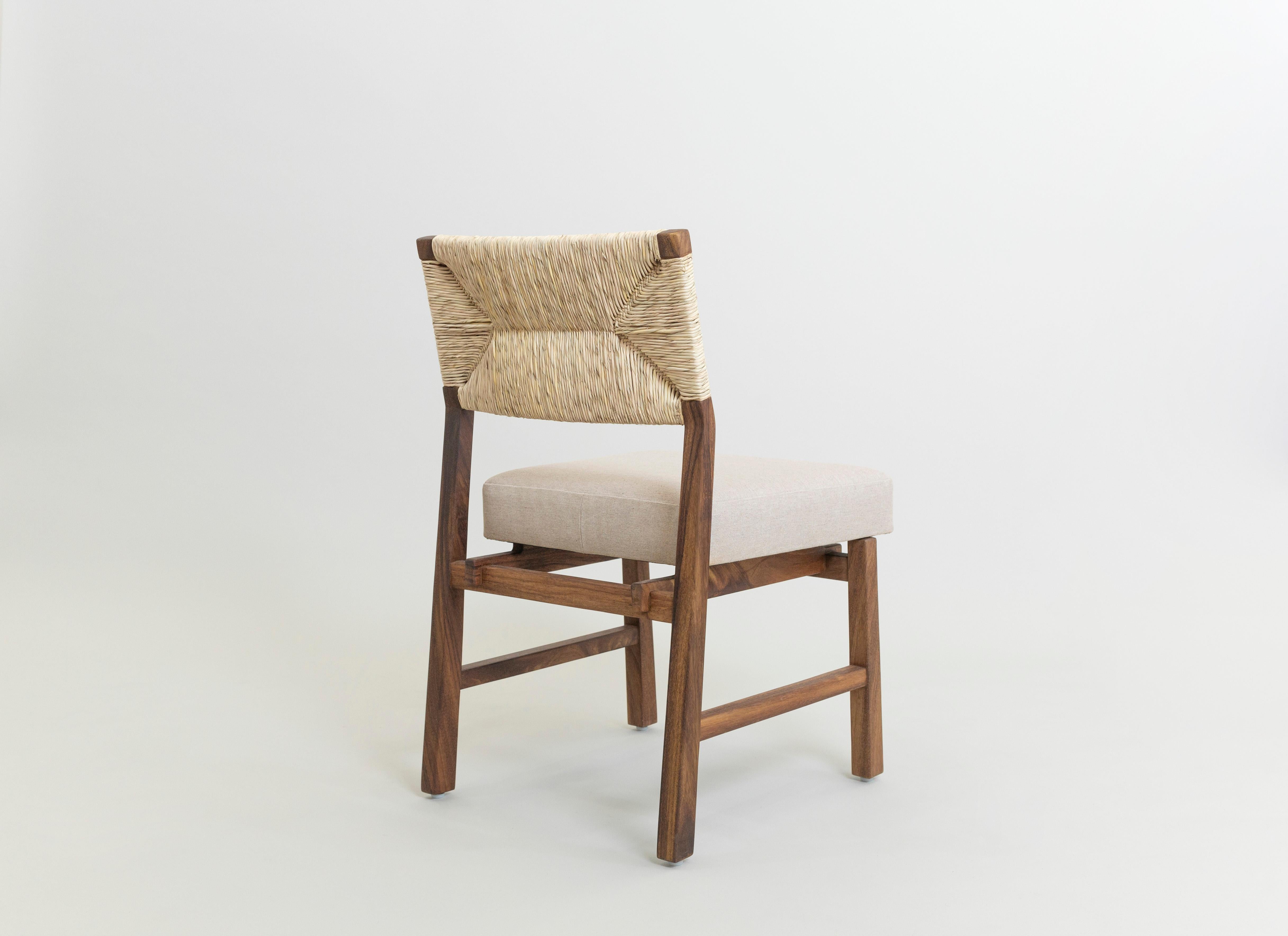 This Classic design has a modern flourish without overshadowing the handcrafted details from the Natural Palm woven back that makes it so unique. The Lago dining chair is made of solid Huanacaxtle, a tropical hardwood from southern Mexico. The