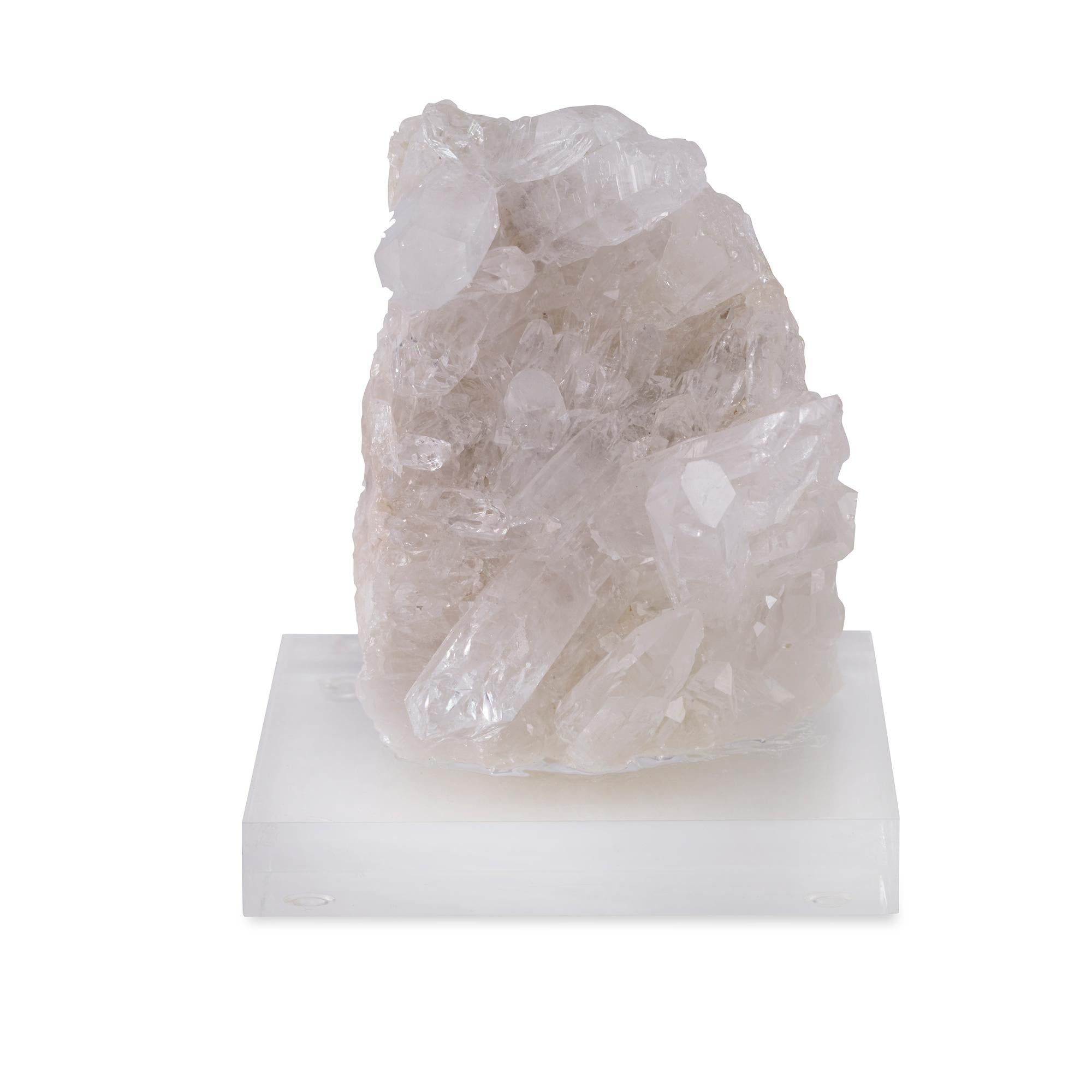 A white crystal cluster mounted on a clear acrylic base. Due to the natural material, variation in size, shape, and color is to be expected.
  