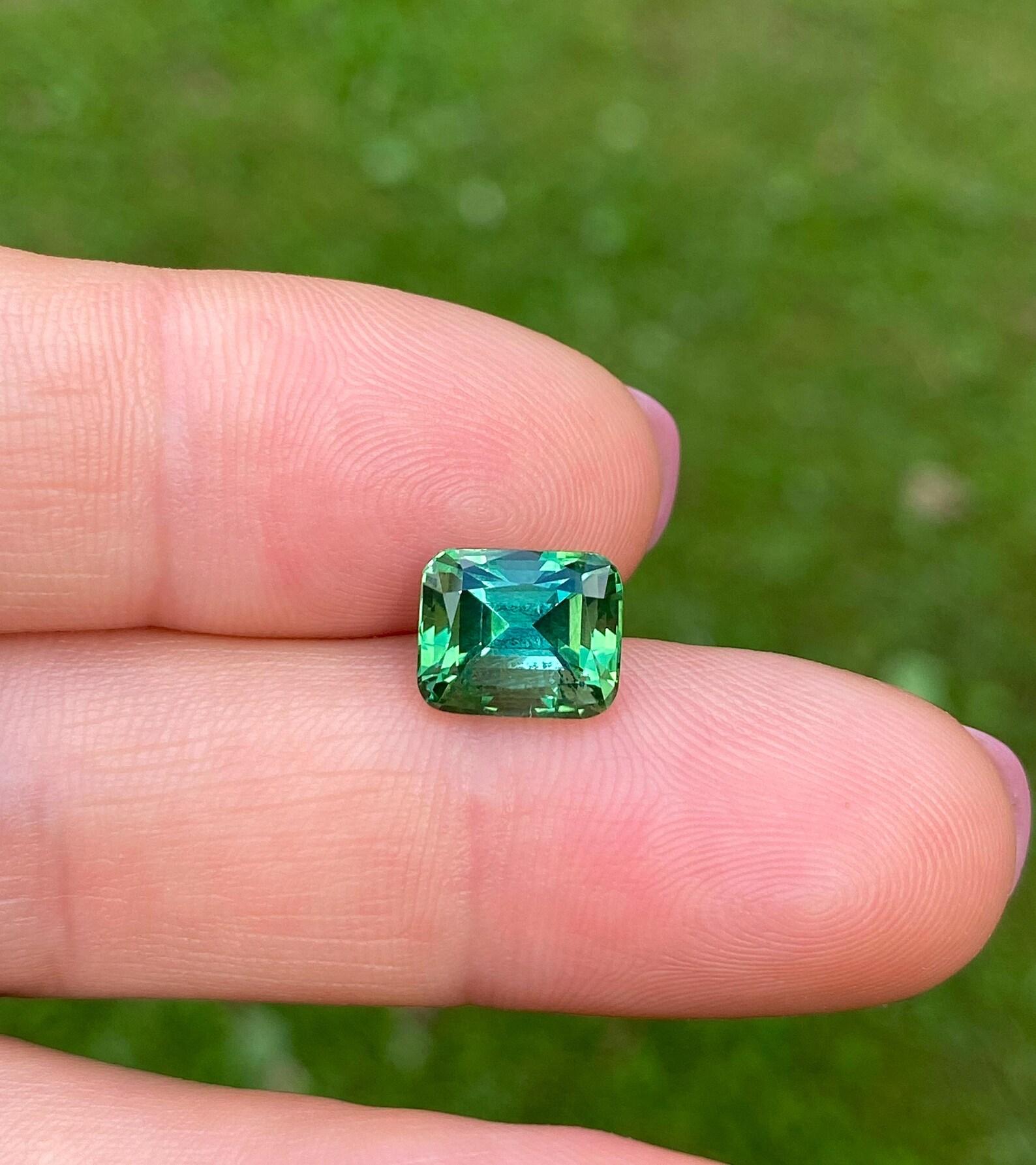 Natural Green Tourmaline Loose Gemstone

Certificate GFCO
Gemstone Color: Green
Gemstone Type: Tourmaline
Gemstone size: 9.24x7.60x6.87 mm
Cut Grade: Excellent
Clarity/Grade: Loop clean
Gemstone Shape: Cushion cut
Gemstone Creation: Natural
Gemstone