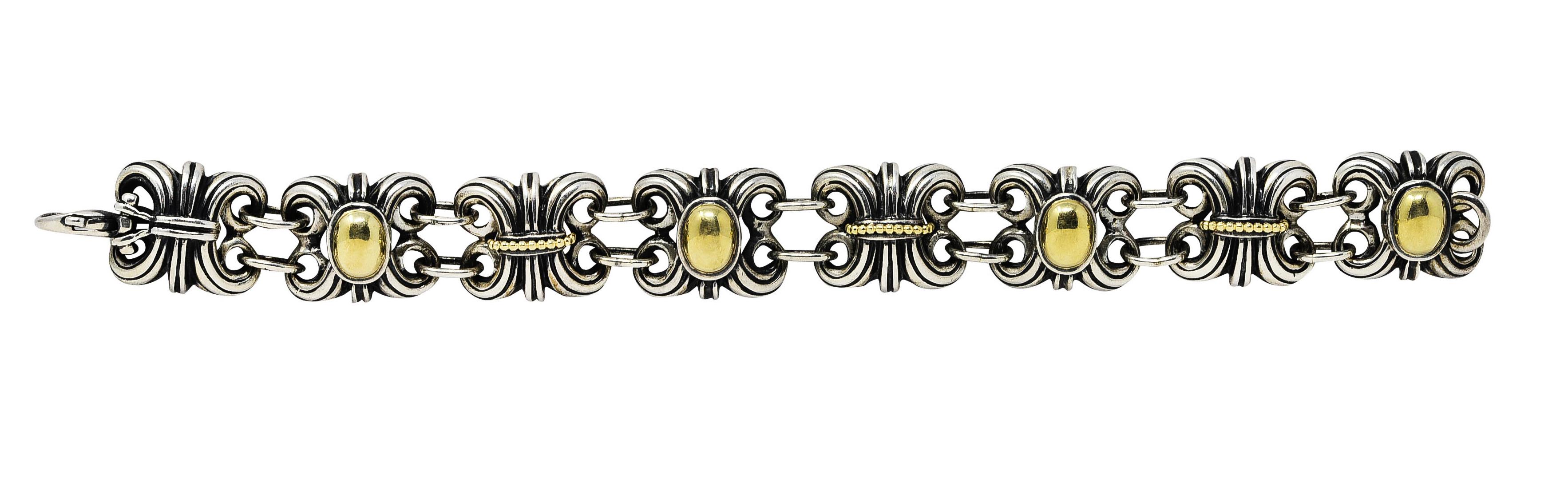 Link bracelet is comprised of scrolling fluted forms

Featuring an oval polished gold face or a row of gold beading

Alternating with sets of jump ring spacer links

Completed by a lobster clasp

Stamped 750 and 925 for 18 karat gold and sterling