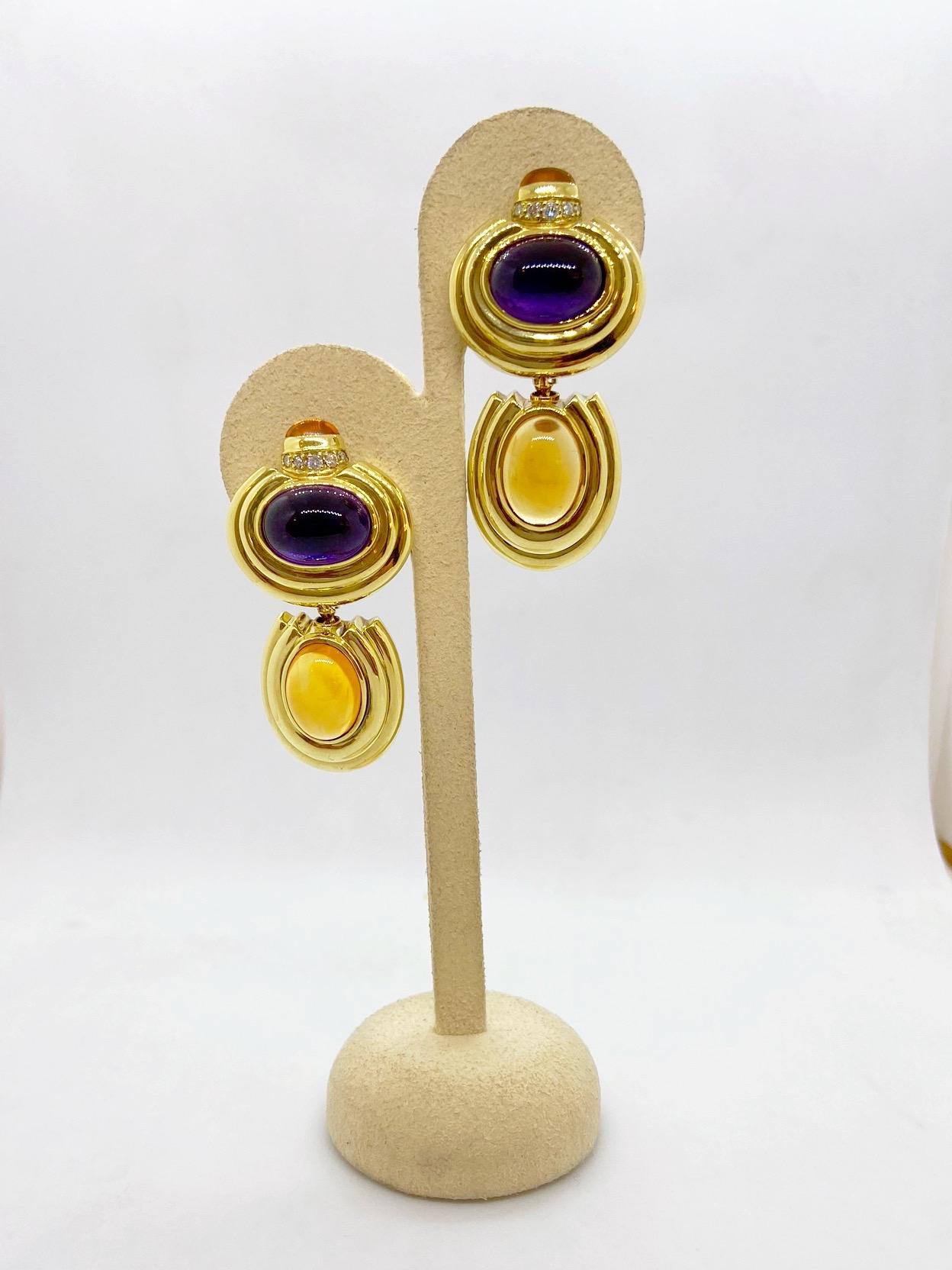 Crafted by Lagos in 18 karat yellow gold, these ear clips feature a cabochon Amethyst and Citrine in each ear. The earrings are clip on, but a post may be added for pierced ears. The earrings measure almost 2