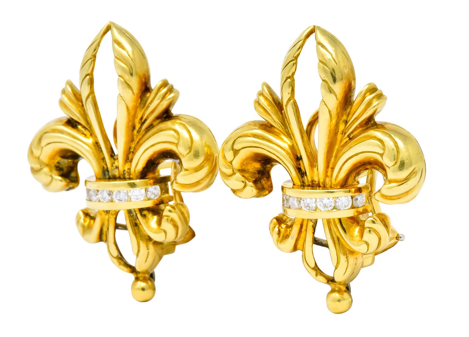 Earrings designed as high polished fleur-de-lis with scrolling foliate motif

Each centering channel set round brilliant cut diamonds weighing approximately 0.30 carat total, G/H color and VS clarity

With signature gold caviar bead at