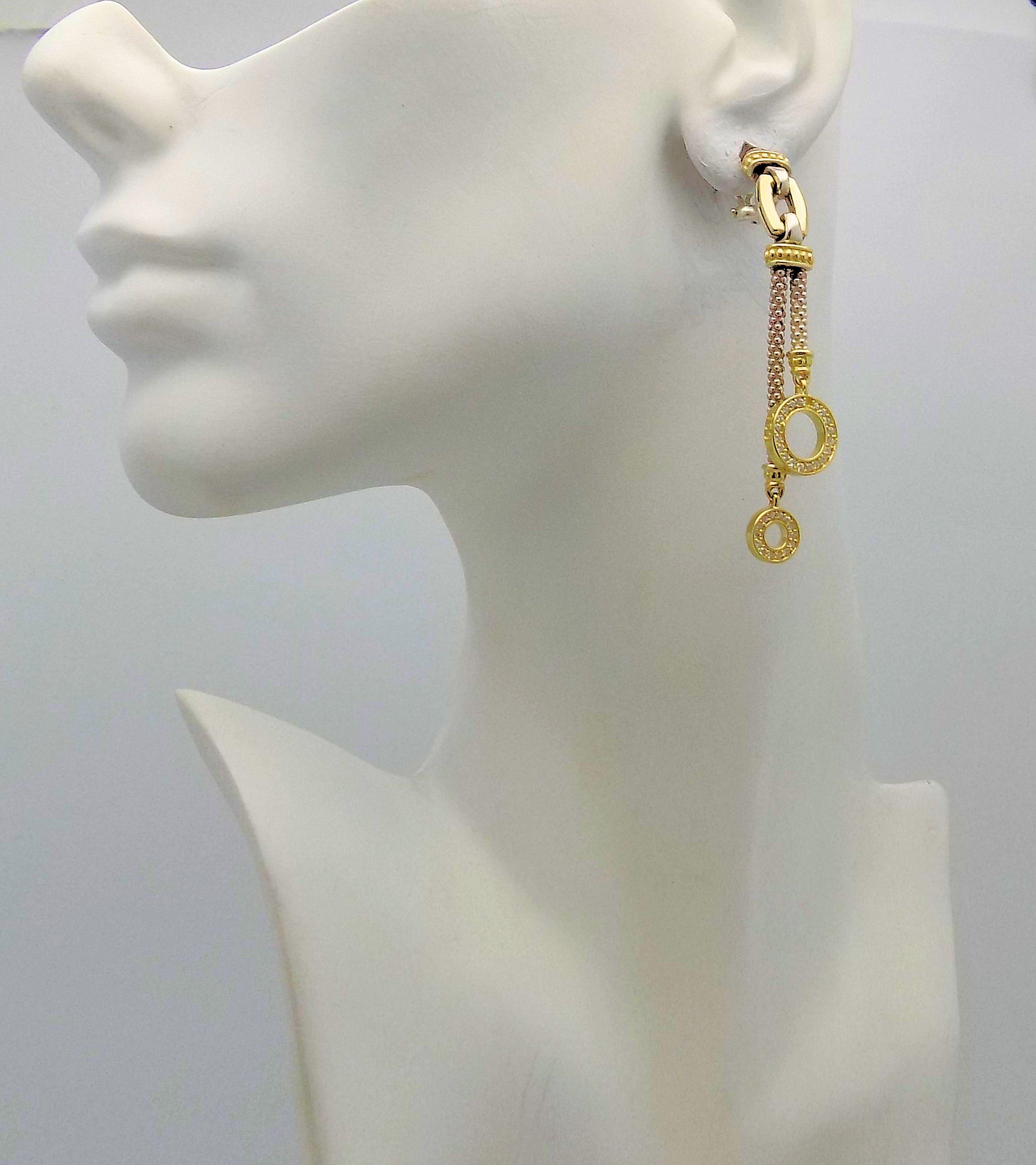 Pair 18 Karat Yellow Gold & Sterling Silver Pendant Clip Earrings Featuring 68 Round Brilliant Diamonds 0.75 Carat Total Weight SI, H. Signed: Lagos Caviar. 2.75