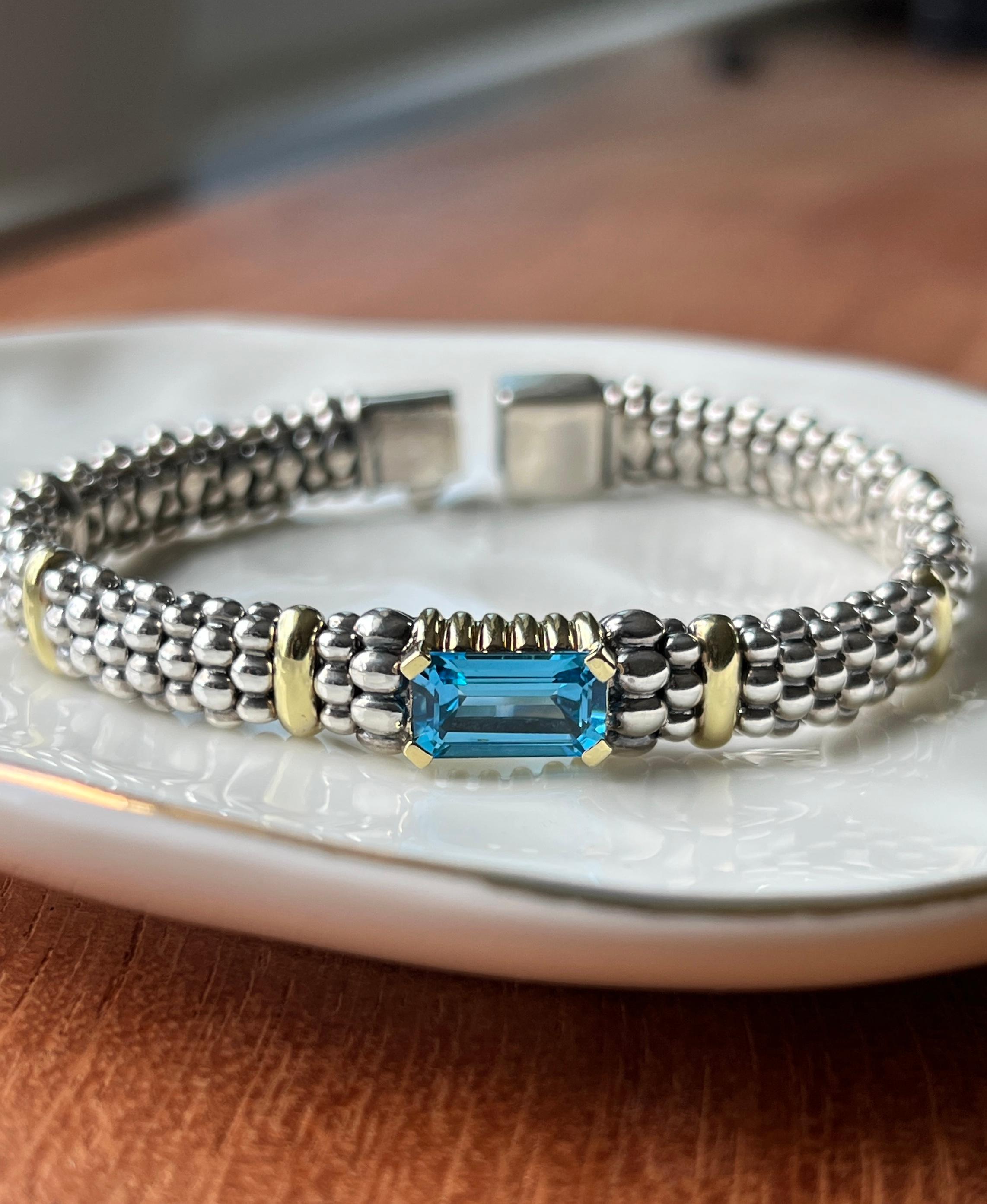 Lagos “Caviar” bracelet in sterling silver and 18k gold with a striking 3.62ct emerald-cut blue topaz. 6.75