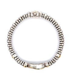 Bracciale Lagos Caviar in argento con perlina circolare in oro 18k con diamanti e maglie lucide