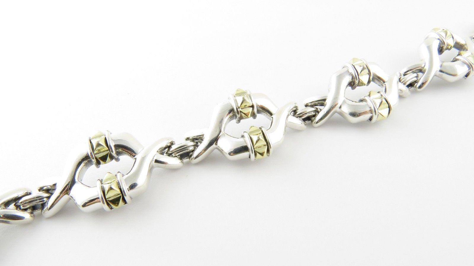 Lagos Caviar Sterling Silver 18K Yellow Gold Link Bracelet

This authentic Caviar bracelet is set in sterling silver and 18K yellow gold

The bracelet is approx. 7.5