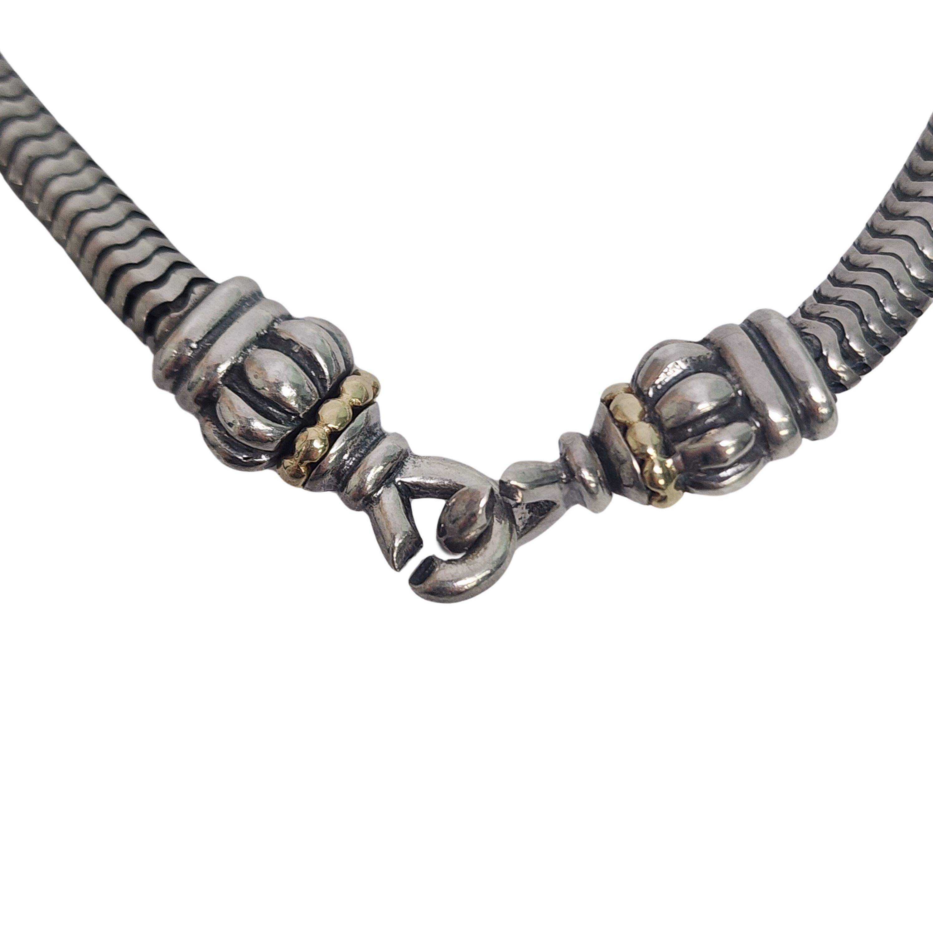 Lagos Caviar sterling silver with 18K yellow gold accent snake chain necklace.

A snake chain necklace featuring end loops that twist to interlock. Yellow gold beaded accent on each end.

Weighs approx 33.1g, 21.3dwt

Measures approx 16
