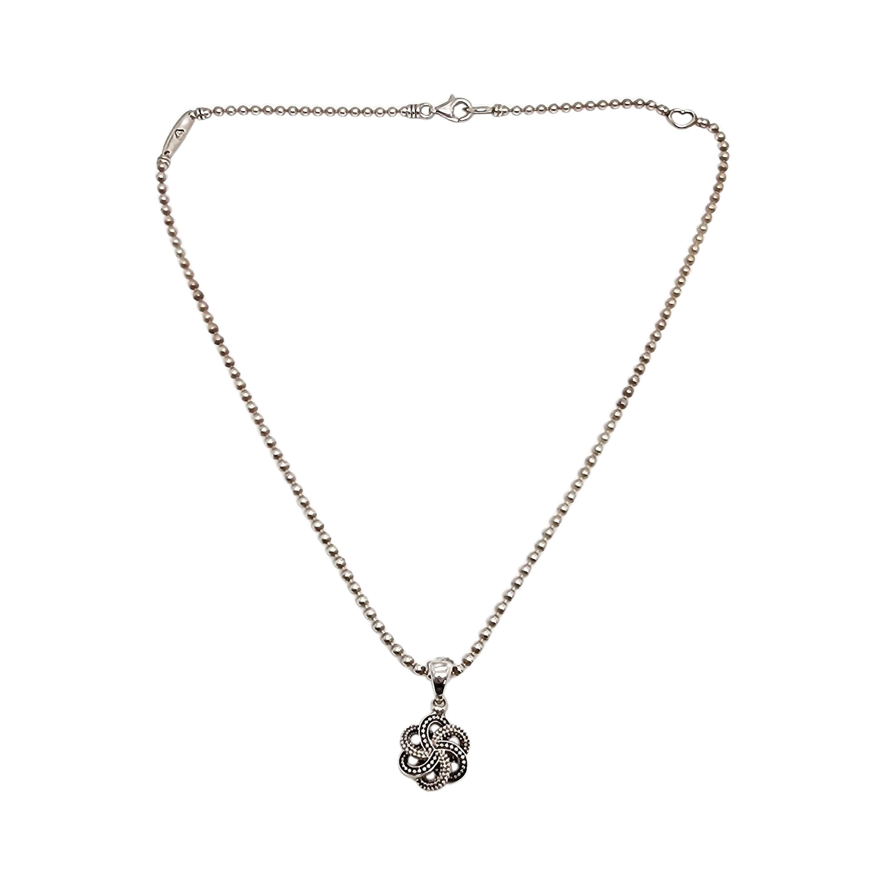 Lagos Caviar sterling silver 18K plated 2-tone Love Knot pendant ball chain necklace, with box and pouch.

Beautiful caviar texture two tone knot pendant featuring 18K yellow gold plated accents on an adjustable length bead ball chain. Includes a