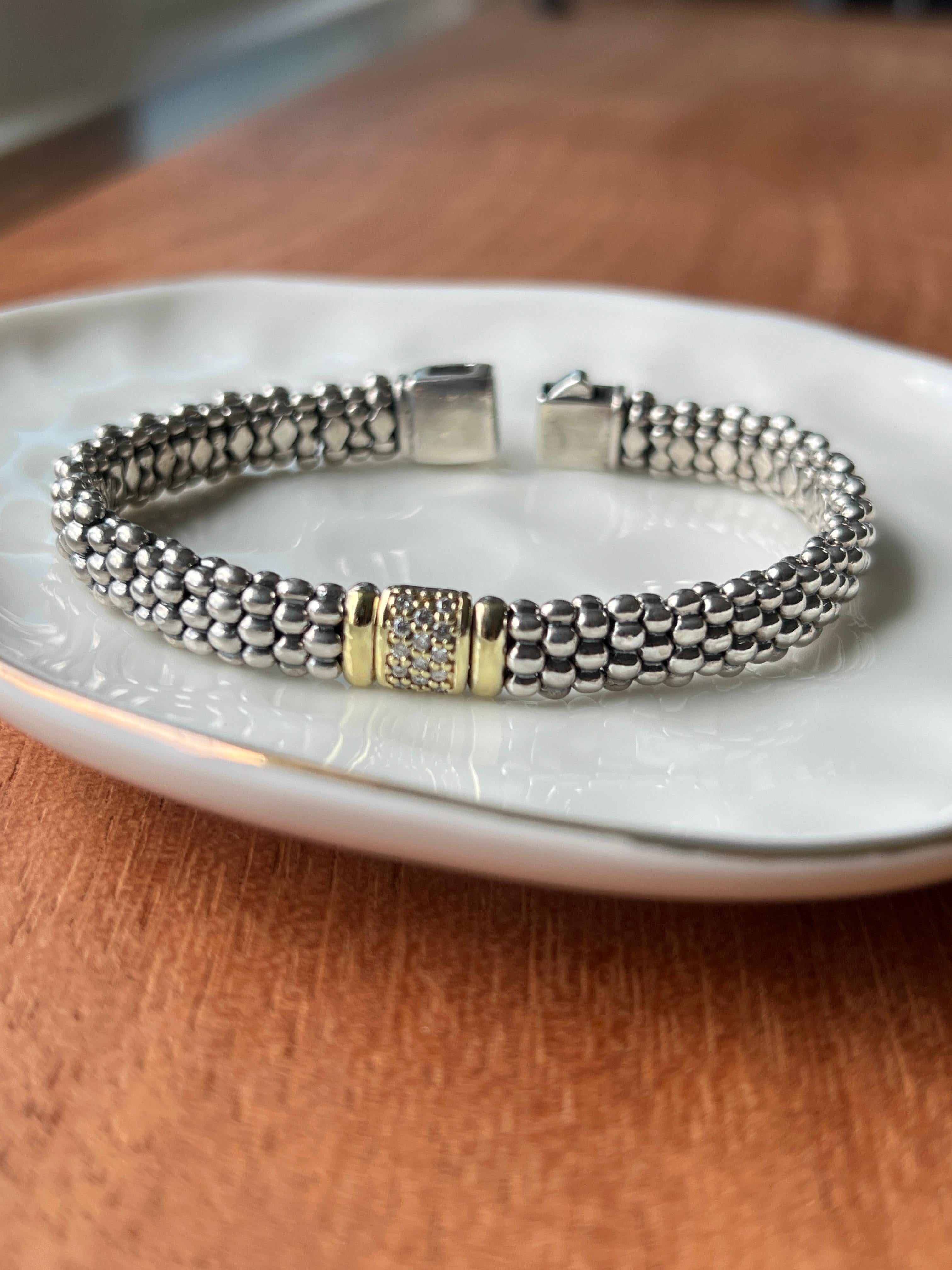 Lagos elegance at its finest — this sterling silver and 18k gold “Caviar” bracelet shimmers with diamonds, blending timeless style with everyday luxury.

Contemporary Lagos “Caviar” bracelet in sterling silver and 18k yellow gold, set with fourteen
