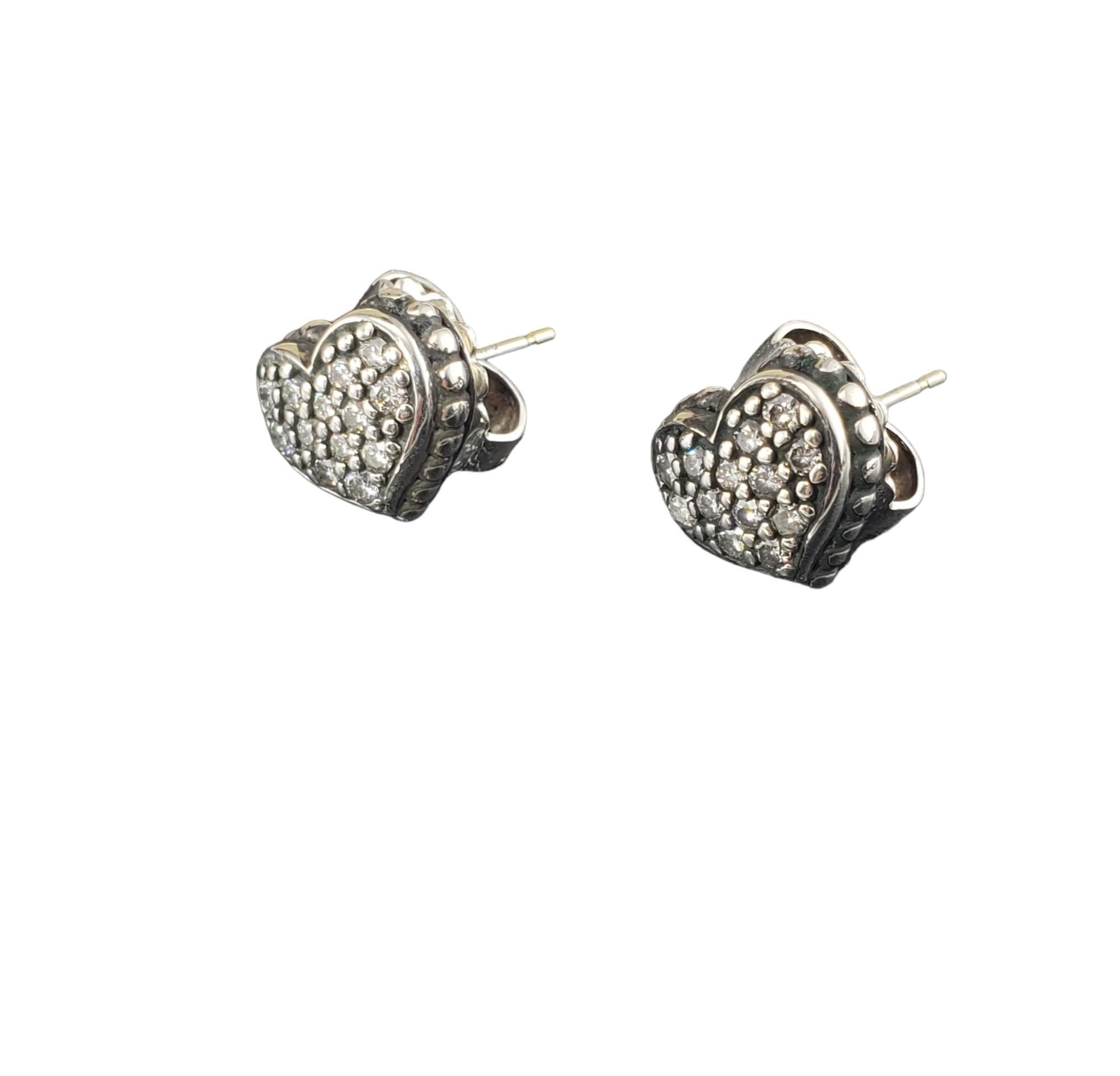 Vintage Lagos Caviar Sterling Silver Diamond Heart Earrings-

These lovely heart earrings each feature 13 round brilliant cut diamonds set in beautifully detailed sterling silver.  Push back closures.

Size: 10 mm x 12 mm

Stamped: Caviar 