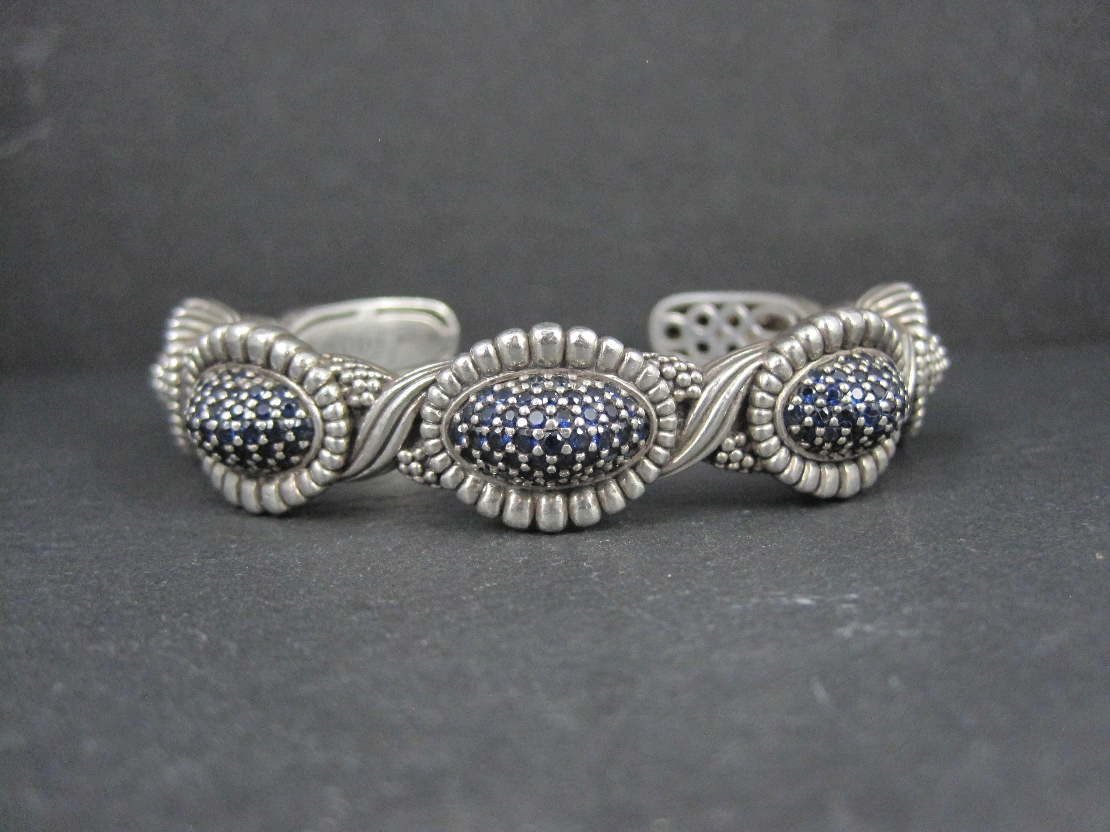 This highly coveted 2012 cuff bracelet comes Lagos' Muse Collection.
Crafted in sterling silver, this bracelet features 3.41 carats in round cut blue sapphires set within the domed stations of an intricate Caviar beaded cuff. 

The face of this