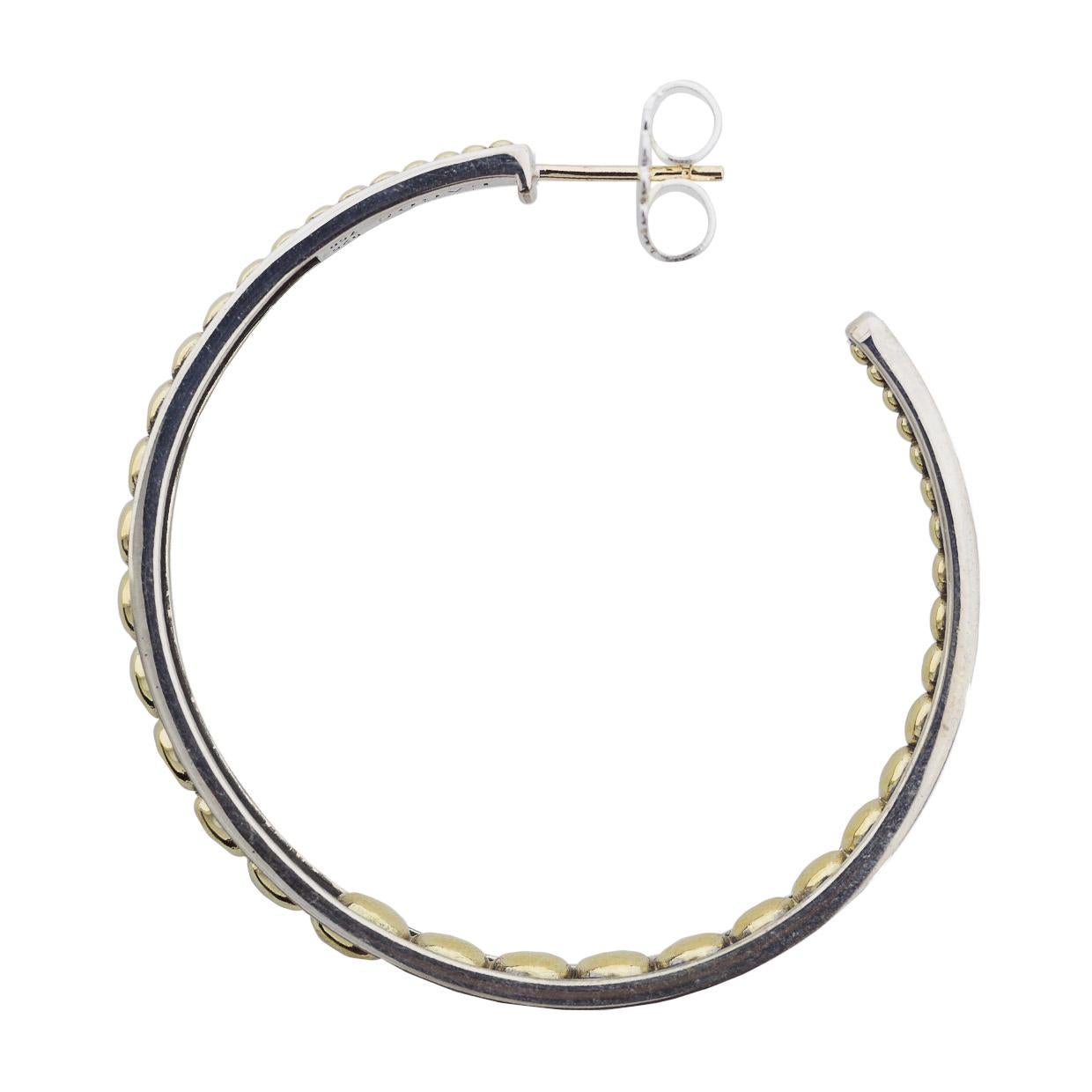 Item Details
Estimated Retail $1,250.00
Brand Lagos
Collection Signature Caviar
Metal 925 Sterling Silver & 18kt Yellow Gold
Finish Polished
Style Hoop
Fastening Butterfly/tension
Length x Width 50 X 6 mm
Diameter 50.00 mm
Metal Purity 925/18k

In
