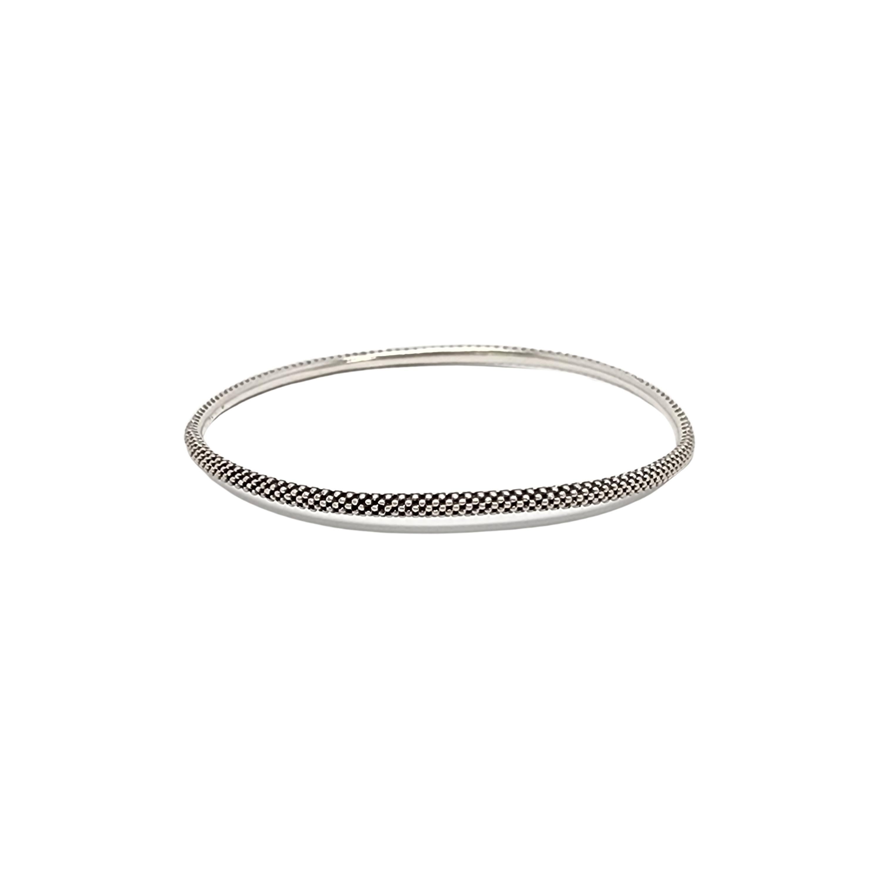 Lagos Signature Caviar sterling silver bangle bracelet.

Beautiful beaded thin bangle bracelet in Lagos iconic caviar design.

Measures approx 3mm wide, 8