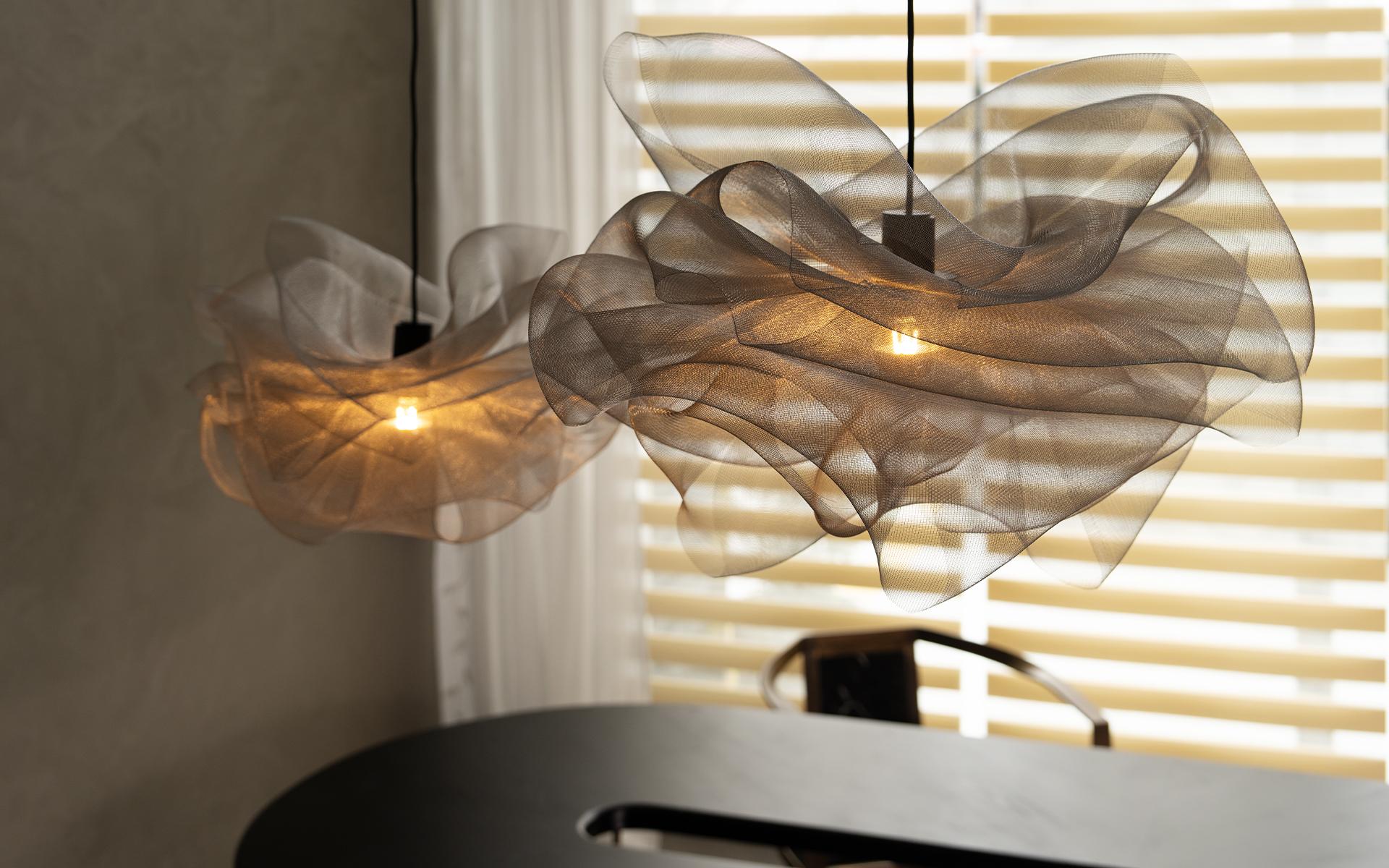 Kumo Pendant Lighting resembles a cloud floating in the air with its light and elegant form.

Thanks to its handcrafted twisted stainless steel wire, it diffuses the light softly and adds a warm atmosphere to the space.

Kumo, which is compatible