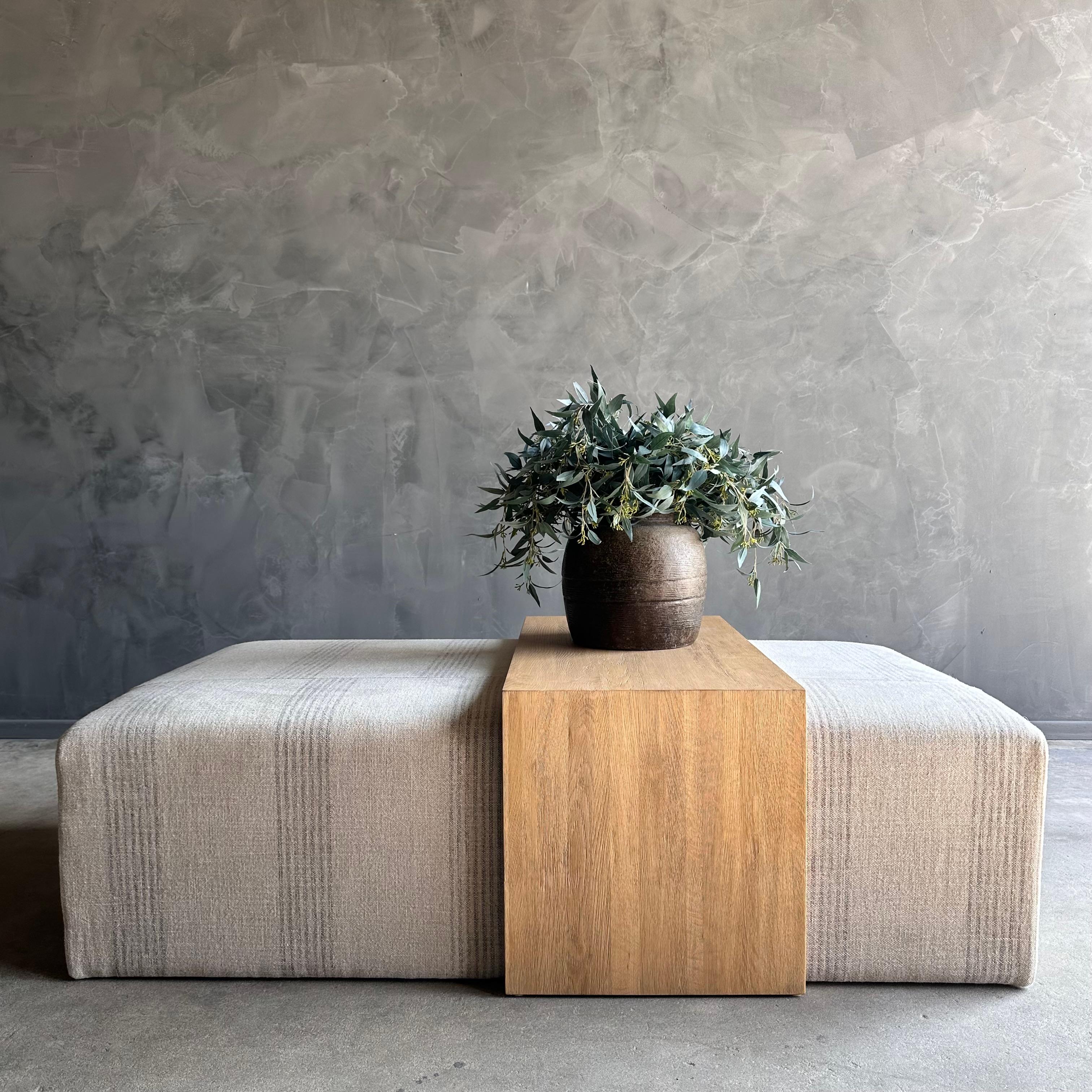 Laguna Cube Ottoman with White Oak Waterfall Style Table

Stone Washed Linen a heavy 18 oz weighted linen, the background is a natural flax color with deep brown ticking stripes called cafe noir. Our linen is stone washed to give a soft hand and
