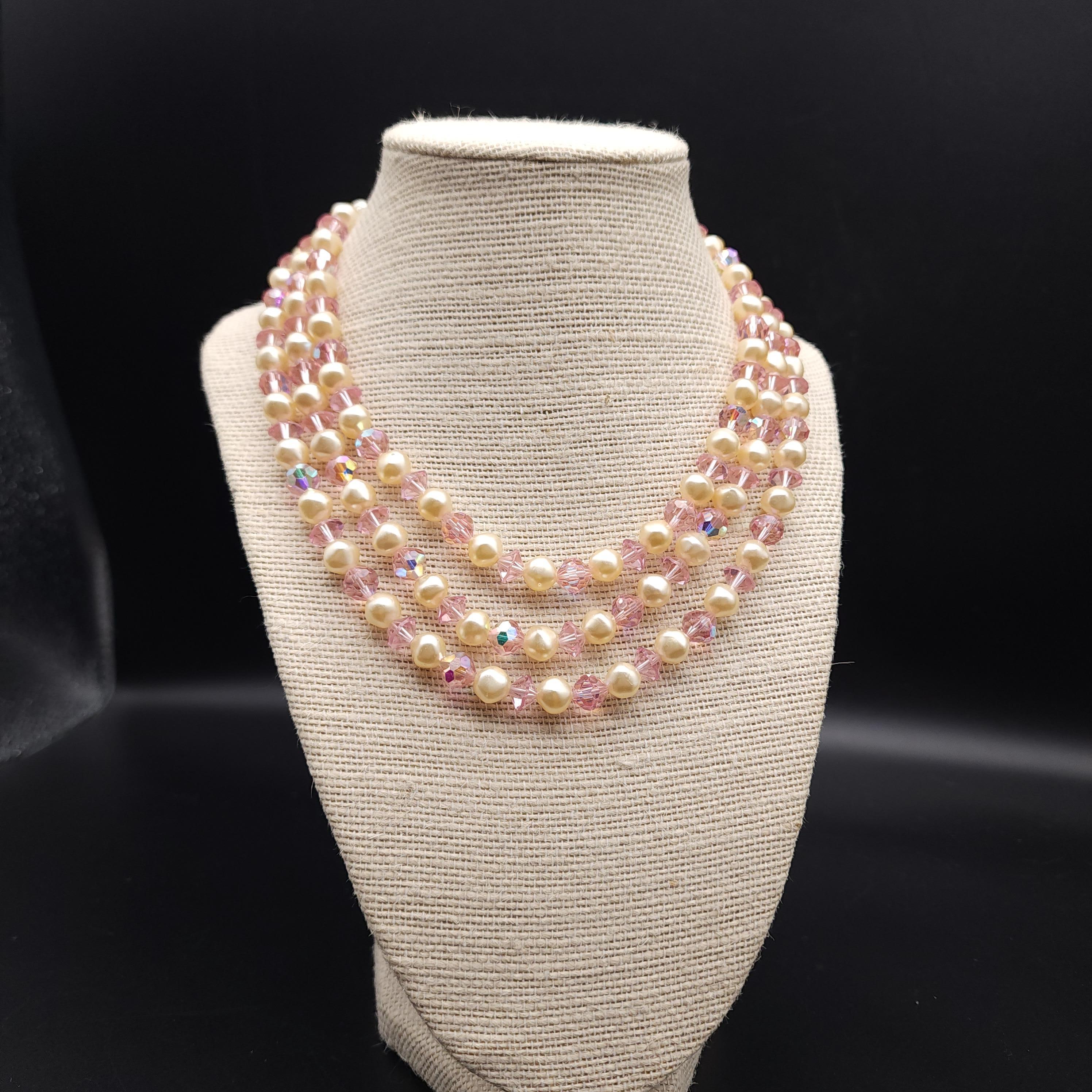 Length: 14.5 inches to 16.5 inches with extension chain
Each faux pearl is approx 1/4 inch / .75 cm

Elevate your ensemble with the timeless elegance of the Laguna rose crystal & faux pearl multi strand necklace. This exquisite vintage piece,