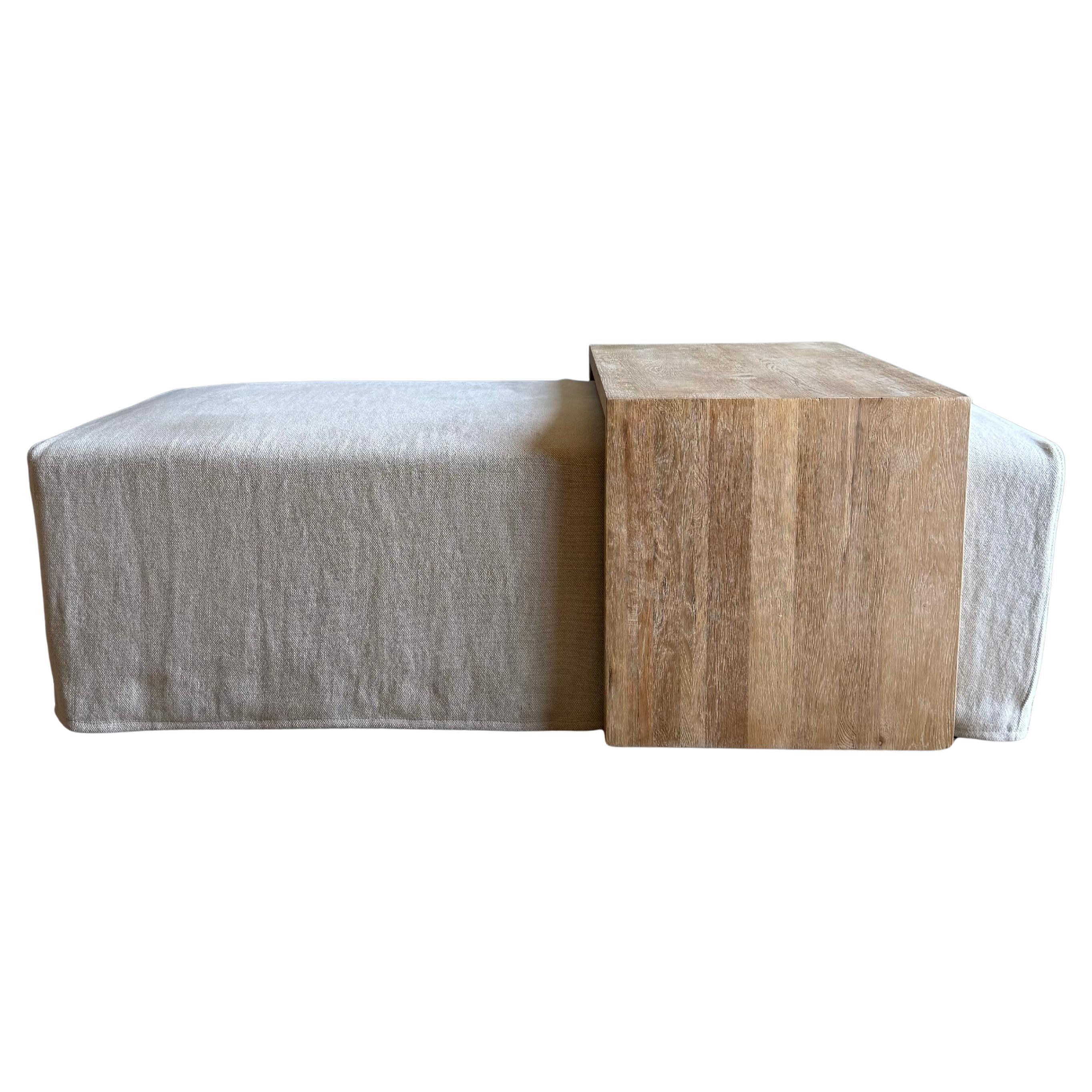 Laguna Slip Covered Ottoman with White Oak Waterfall Style Table.