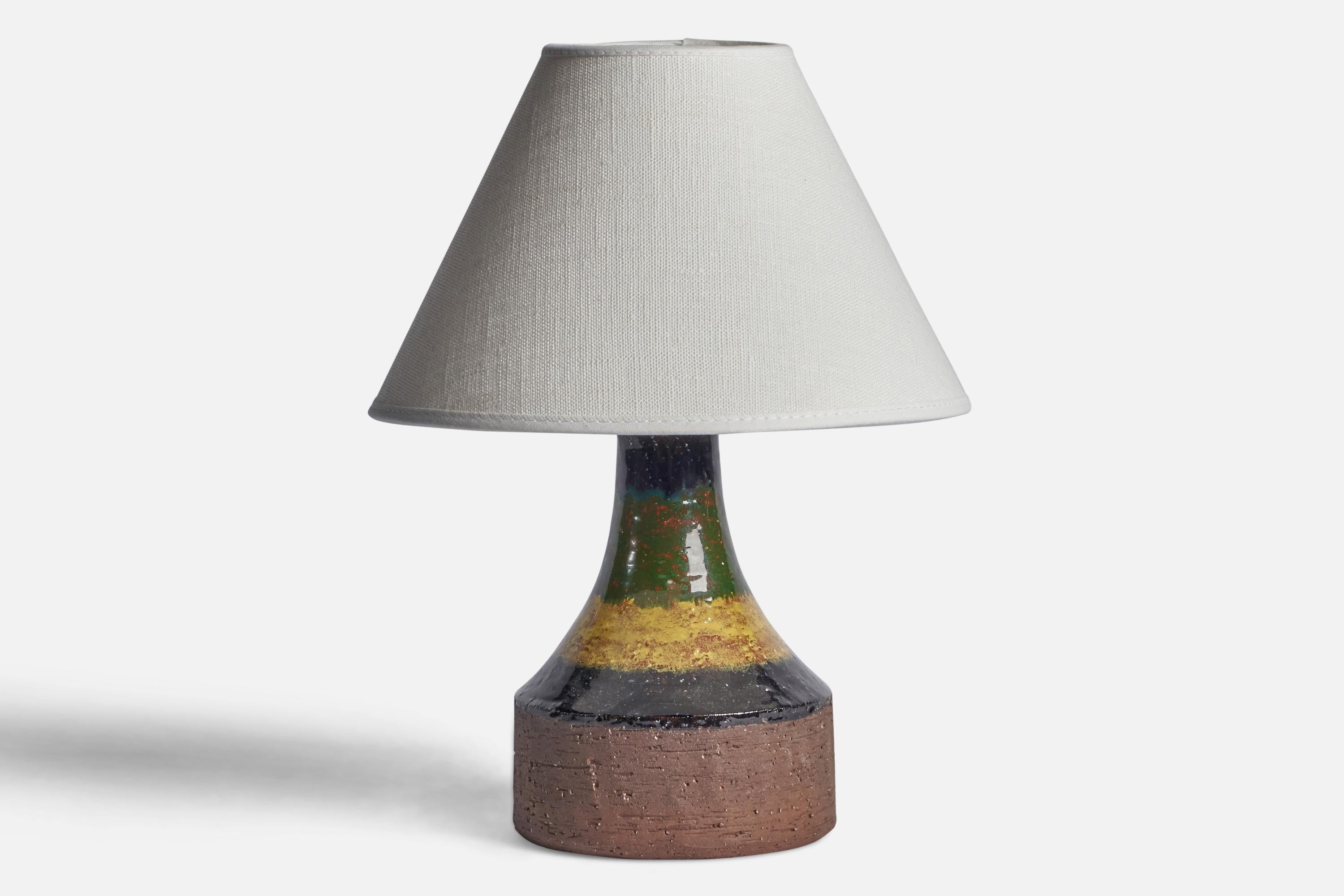 A small black and yellow-glazed stoneware table lamp designed and produced by Laholm Keramik, Sweden, c. 1960s.

Dimensions of Lamp (inches): 8” H x 4.3” Diameter
Dimensions of Shade (inches): 3” Top Diameter x 8” Bottom Diameter x 5” H 
Dimensions
