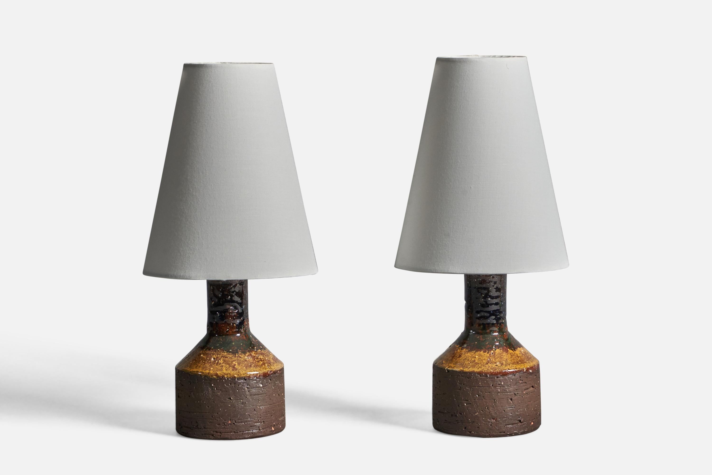 A pair of black and yellow-glazed stoneware table lamps, designed and produced by Laholms Keramik, Sweden, c. 1960s.

Dimensions of Lamp (inches): 7.5
