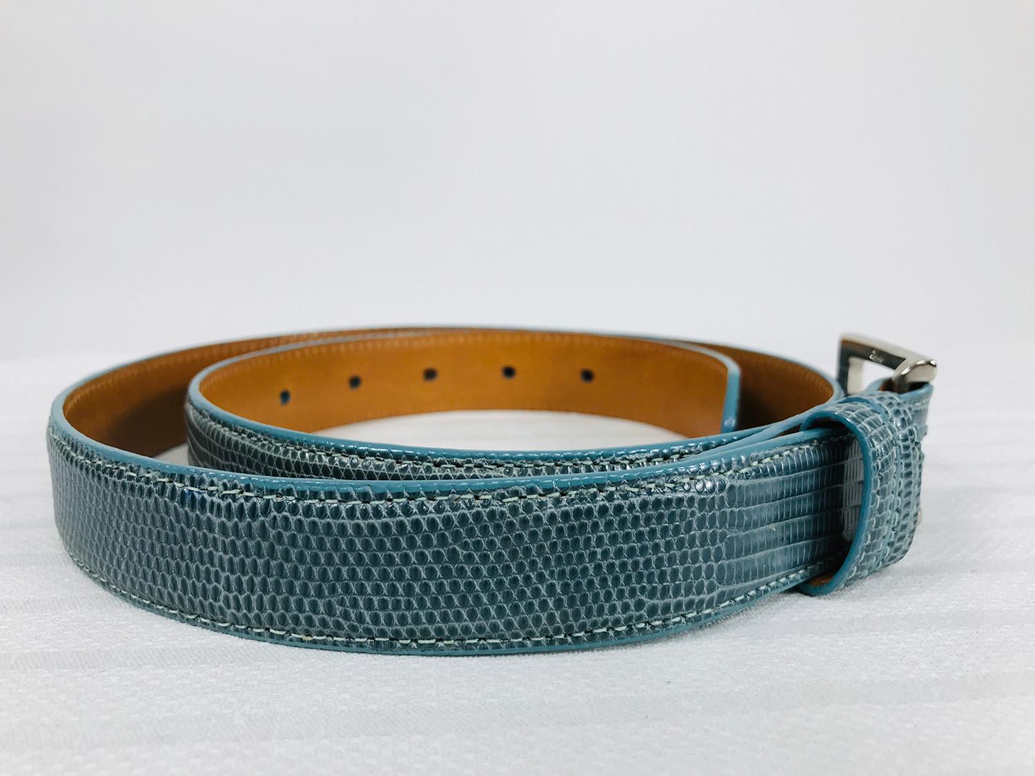 Lai blue lizard belt with silver blue enamel and silver metal buckle, lined in tan leather, marked size medium. In very good pre owned condition.
Measurements are in inches:
Buckle 1 1/4 x 1 1/4
Belt strap only 36 1/2
Belt width 1