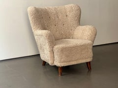 "Laila" armchair by Ilmari Lappalainen in sheepskin, 1950's