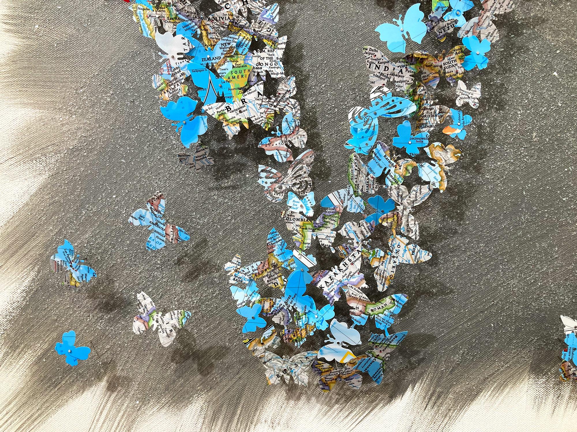 This piece is executed with hundreds of hand cut butterflies, and comes displayed in an acrylic shadow box. These works conjure sensations of nostalgia, created from maps, cutting out words, symbols, and places to create feelings of unity within the