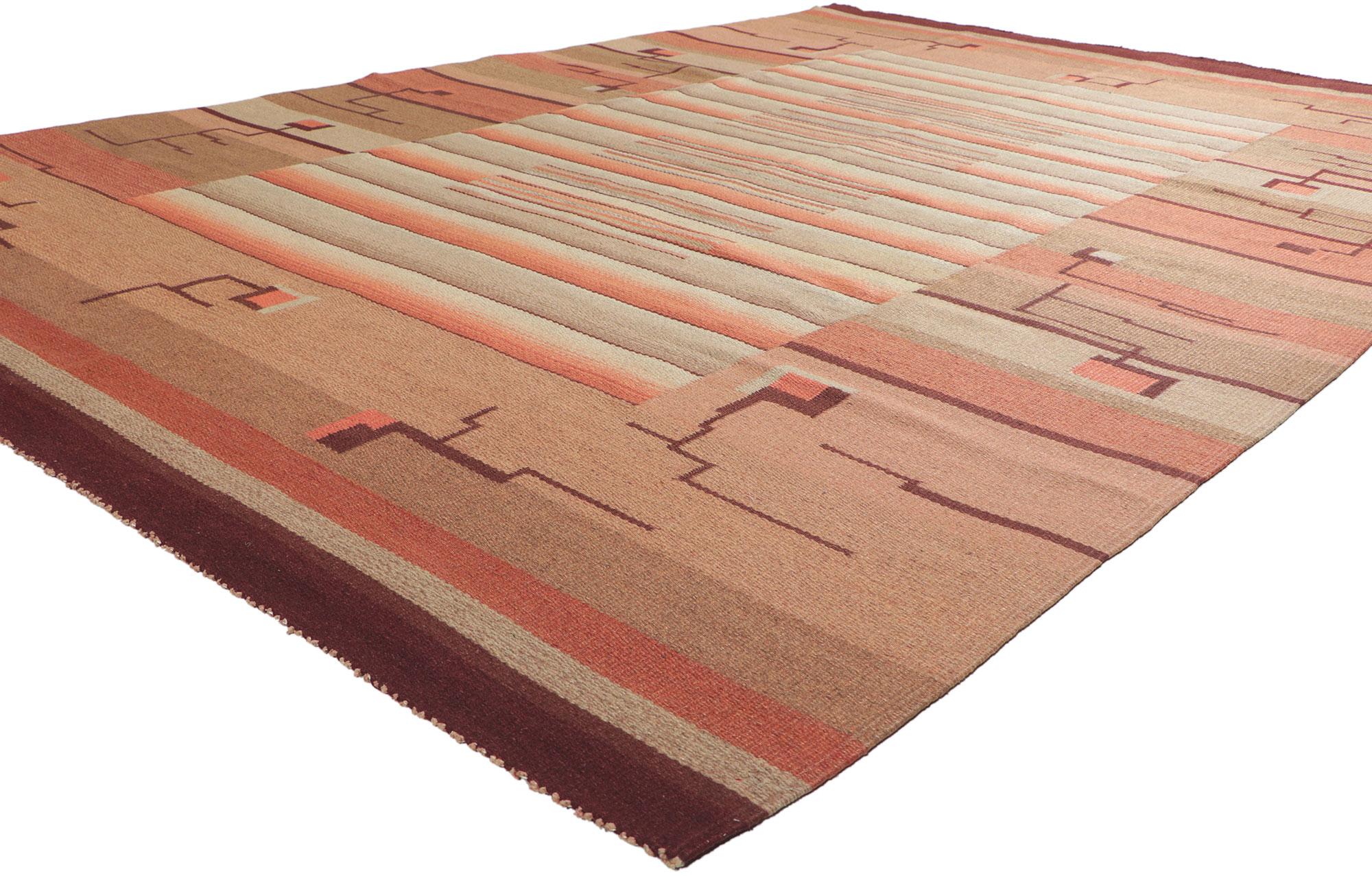 78466 Laila Karttunen Finnish Flatweave Rug, 06'06 x 09'08.
Bauhaus simplicity meets stylized Art Deco in this vintage Finnish flatweave rug. The eye-catching geometric design and earthy colorway woven into this piece work together creating a truly