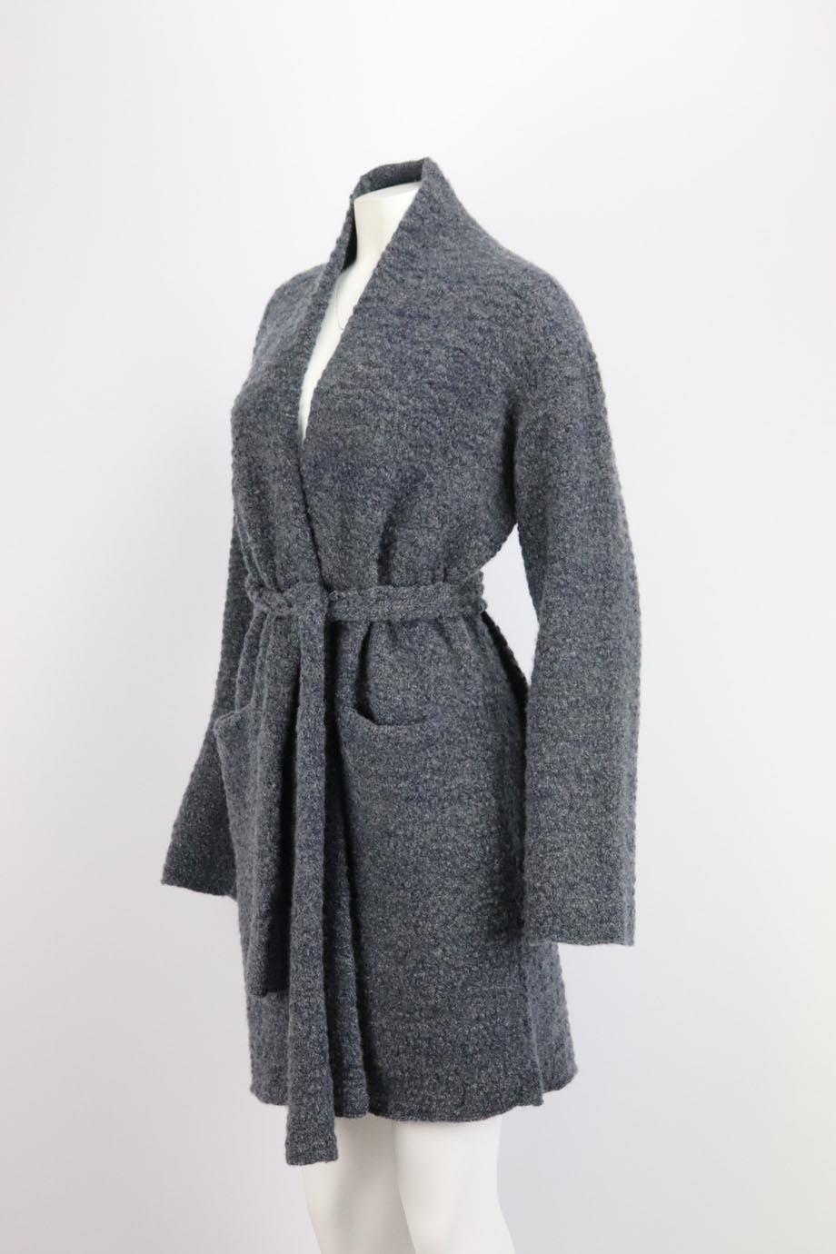 This cardigan by Lainey Keogh is knitted from the softest cashmere with textured finish and has a belt fastening to cinch in the waist in a beautiful blue hue. Blue cashmere. Belt fastening at front. 100% Cashmere. Size: One Size. Bust measures