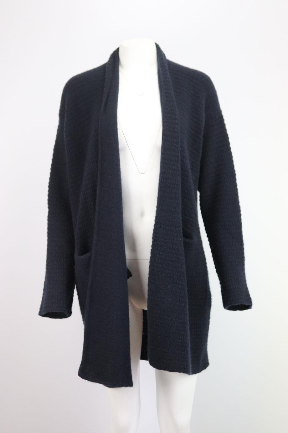 This cardigan by Lainey Keogh is knitted from the softest cashmere with a textured finish and has a loose oversized open fit in a beautiful navy hue. Navy cashmere. Slips on. 100% Cashmere. Size: One Size. Bust measures approx. 40 inches. Waist