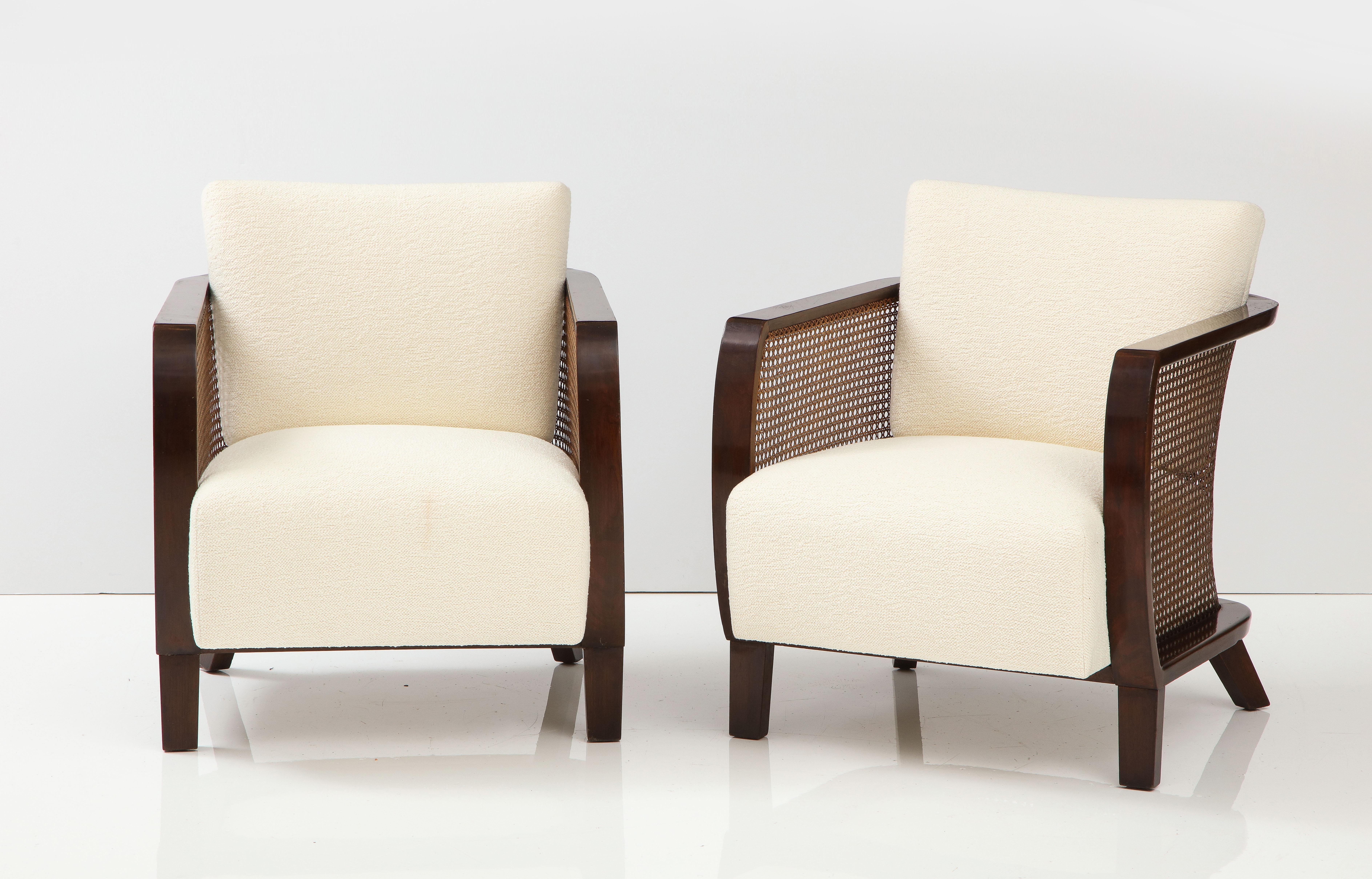 Pair of walnut and caned armchairs by Lajos Kozma.
Pair of walnut and caned armchairs designed by Austrian architect Lajos Kozma, 1930's. The arm chairs are distinguished by a bold and strong outline of beautifully curved wood design with caned