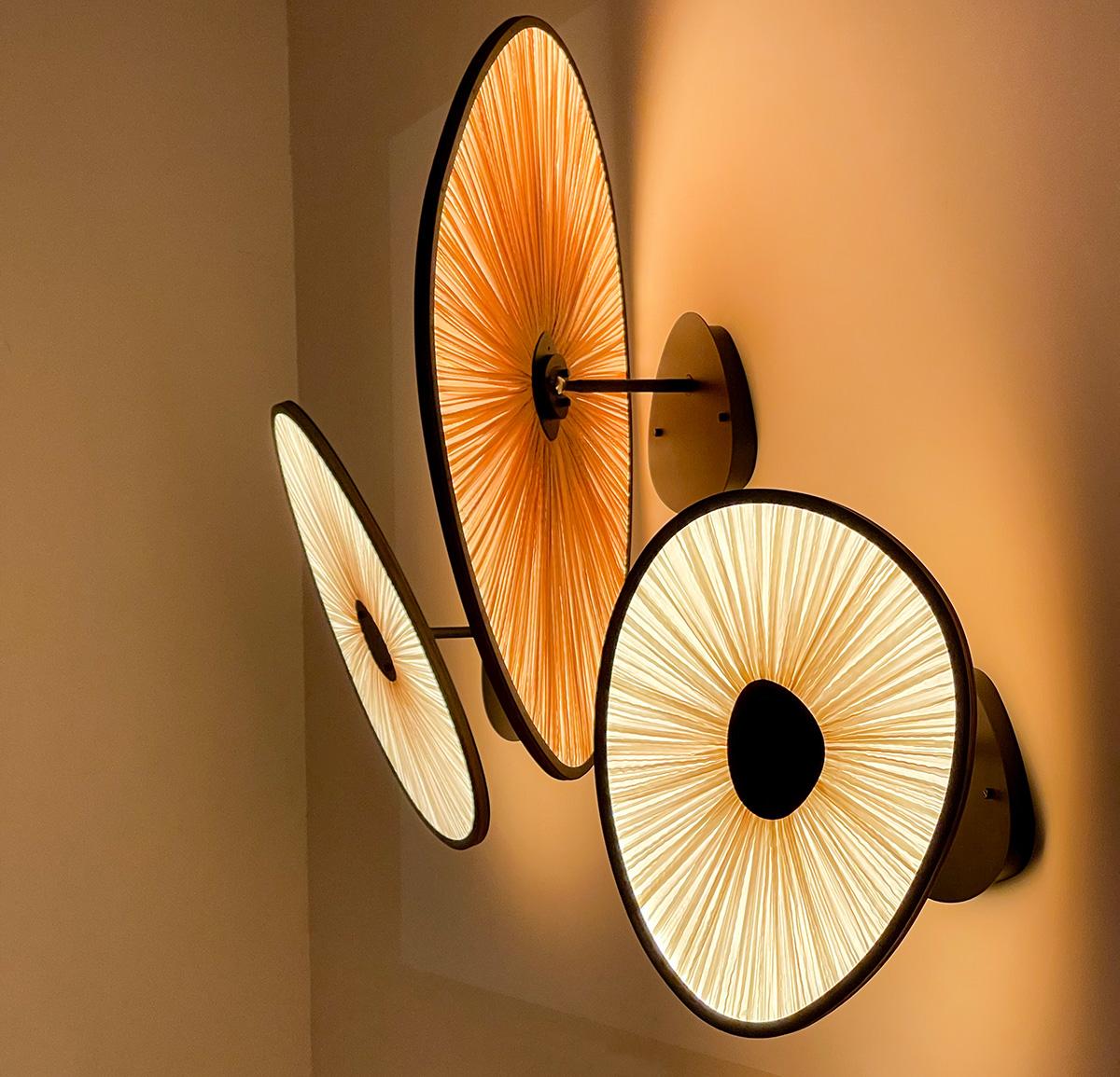 The Lake Doiran Wall & Ceiling Light is a stunning lighting fixture that elegantly showcases its luminous glow against the wall. The rotating shades create a beautiful interplay of colors, adding a touch of drama to any space. This exquisite design