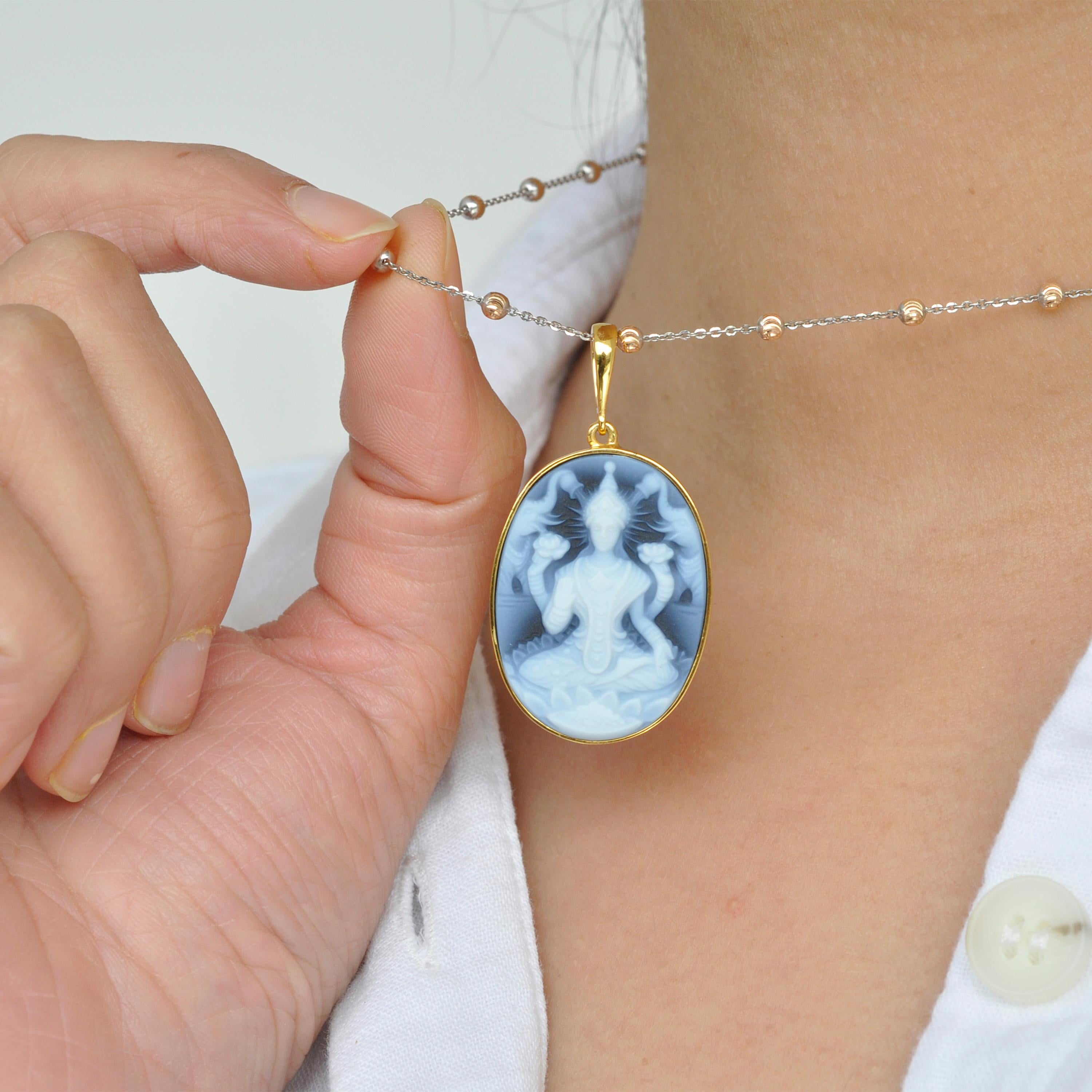 Lakshmi agate cameo carving sterling silver pendant necklace
 
Lakshmi is one of the Principal Goddess of wealth, beauty, prosperity, fortune and power. The carving of Goddess Lakshmi on the relief of a Natural Agate is extremely intricate and