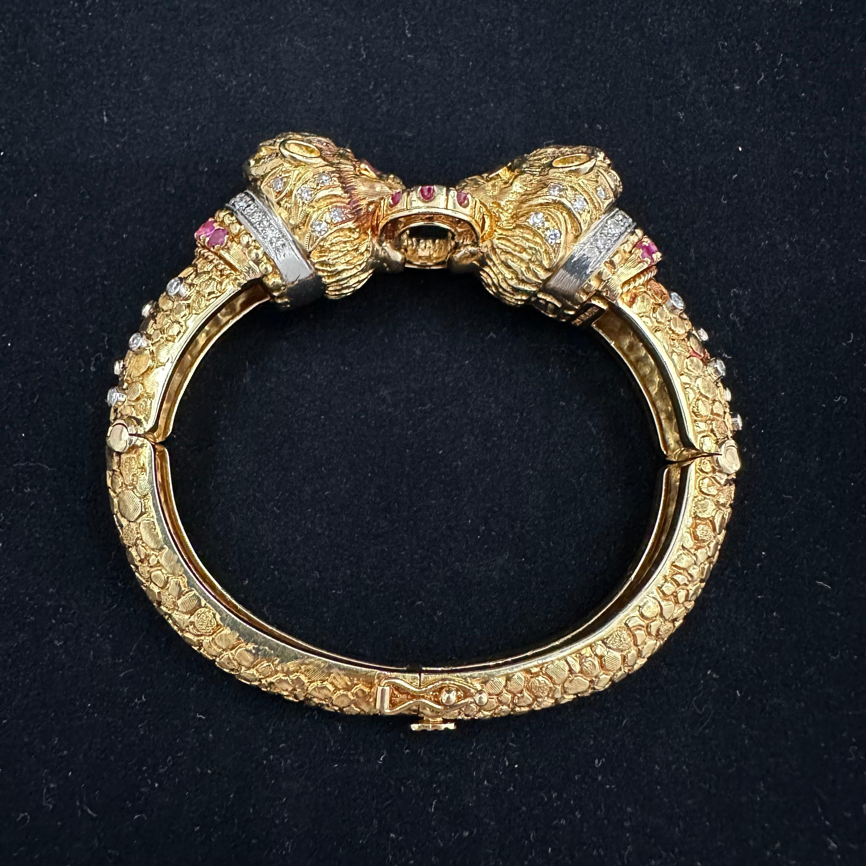 Ilias Lalaounis, jeweler, artist, and academician,
became world renowned for creating luxurious gold jewelry steeped in history
 
1960's Double Lion Head Bracelet.
18k Yellow Gold Hinged Bracelet  Encrusted with 89 Round Diamonds and 20 Red Rubies.