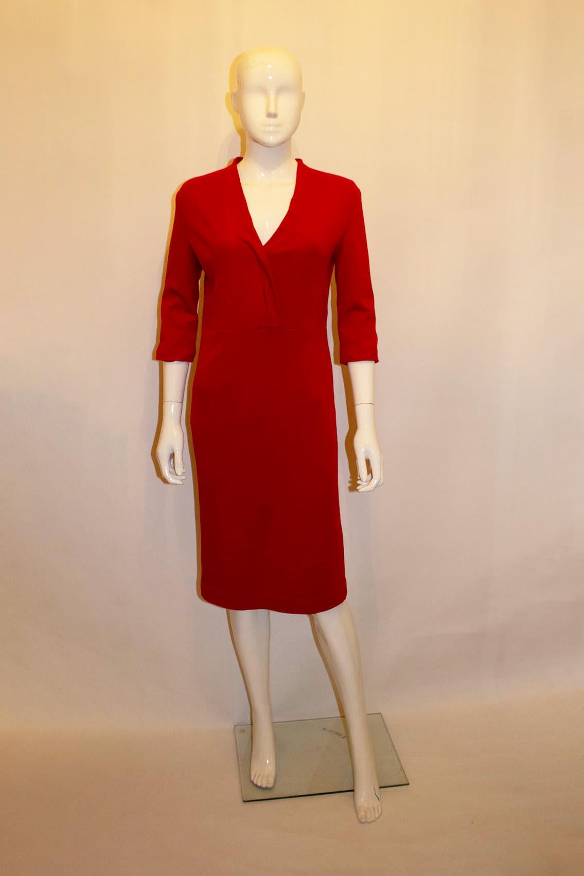 A great dress for Fall / Winter from Lalage Beaumont. In a red woo jersey fabric , the dress has a v neckline, elbow length sleaves and back central zip. It is fully lined.
Measurements : Bust 36'',length 40''