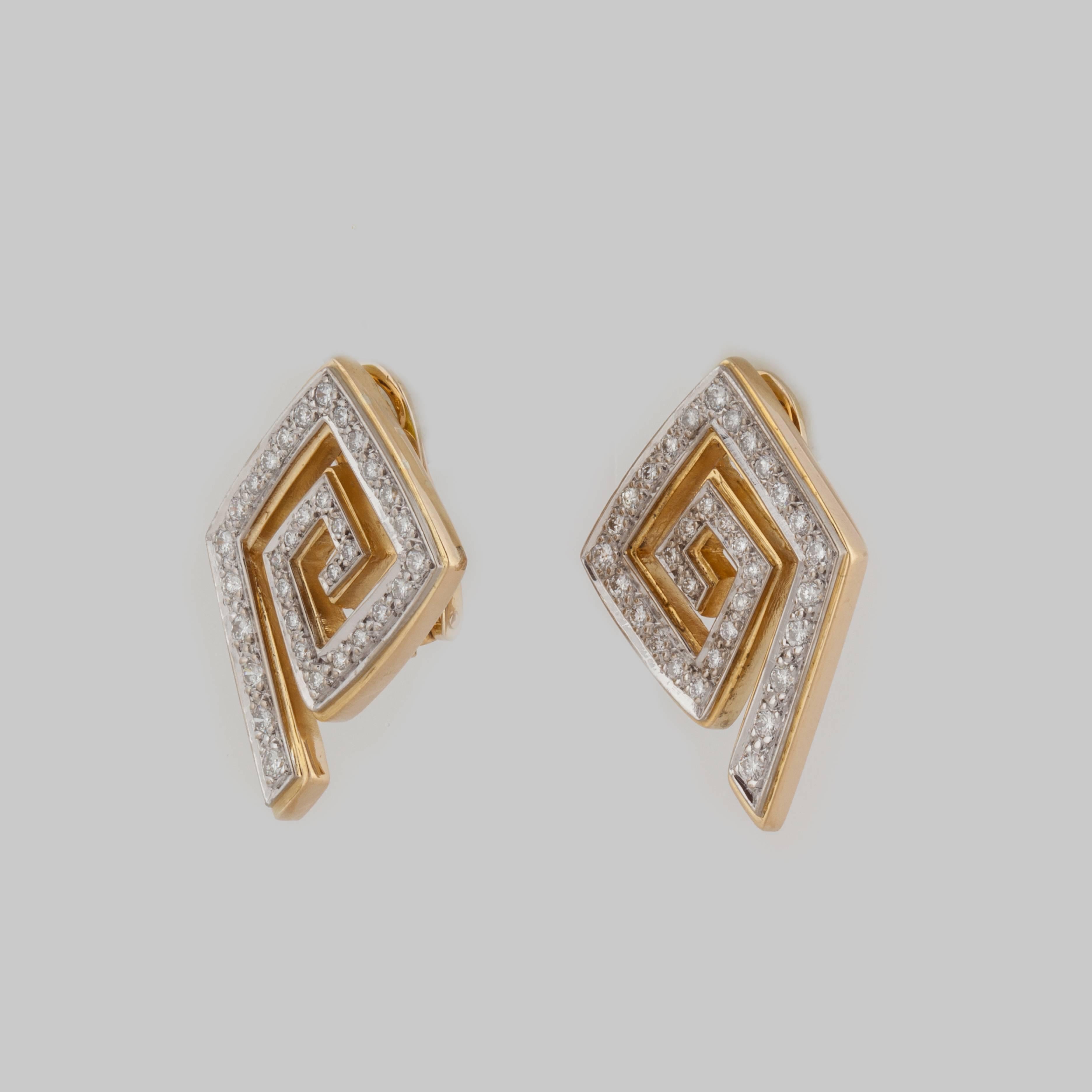 18K yellow gold and diamond earrings by Greek designer LaLaounis.  They are shaped in a geometric spiral with sixty-six (66) round diamonds that total 1.20 carats, G-H color and VS-SI clarity.  They measure 1 1/4 inches long and 7/8 inches wide. 