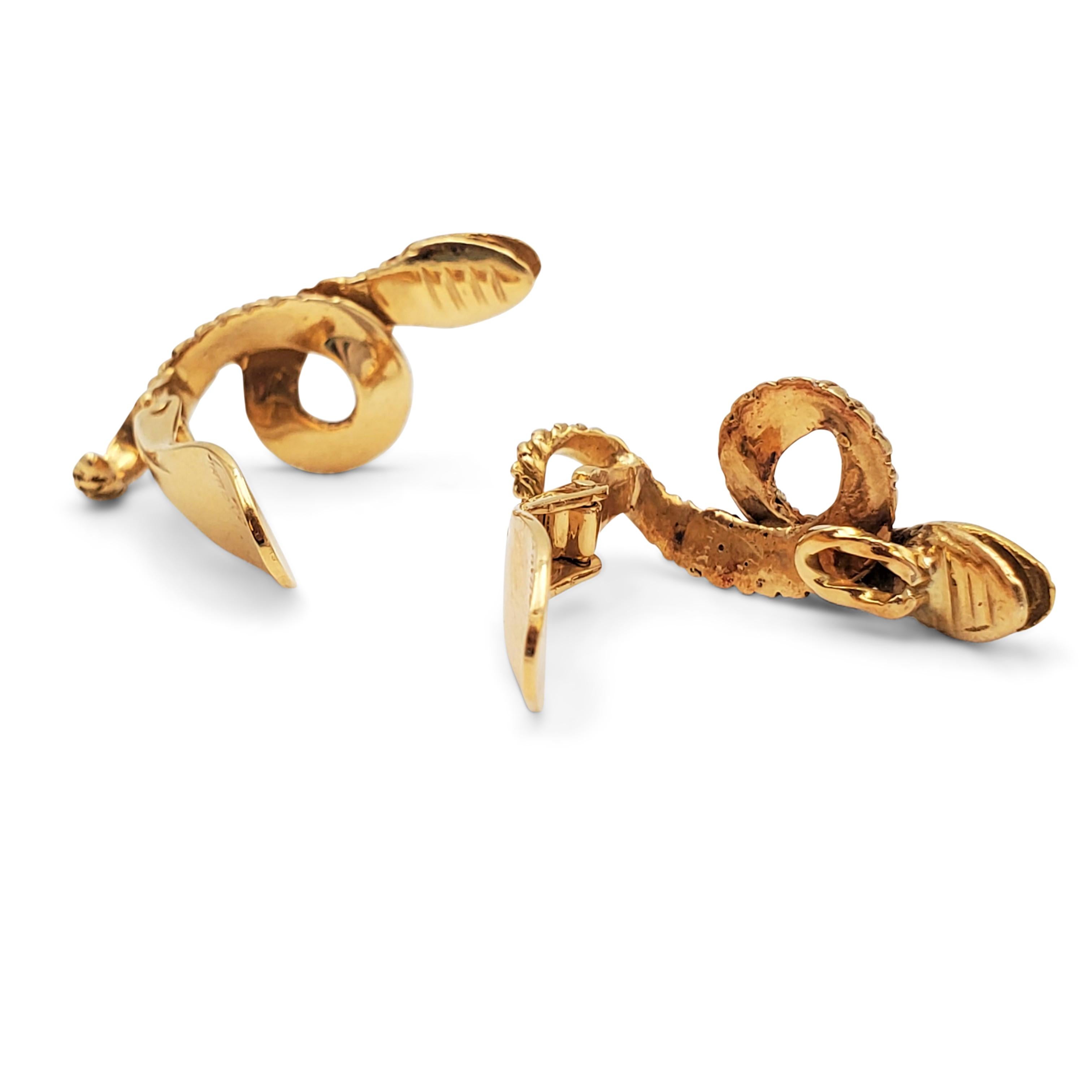 Authentic Lalaounis earclips crafted in 18 karat yellow gold,  Designed as coiling snakes, the earrings measure 1 inch in length and 1/2 inch at the widest point.  Signed Lalaounis, K18, Greece. Not presented with original box or papers. CIRCA 1980s