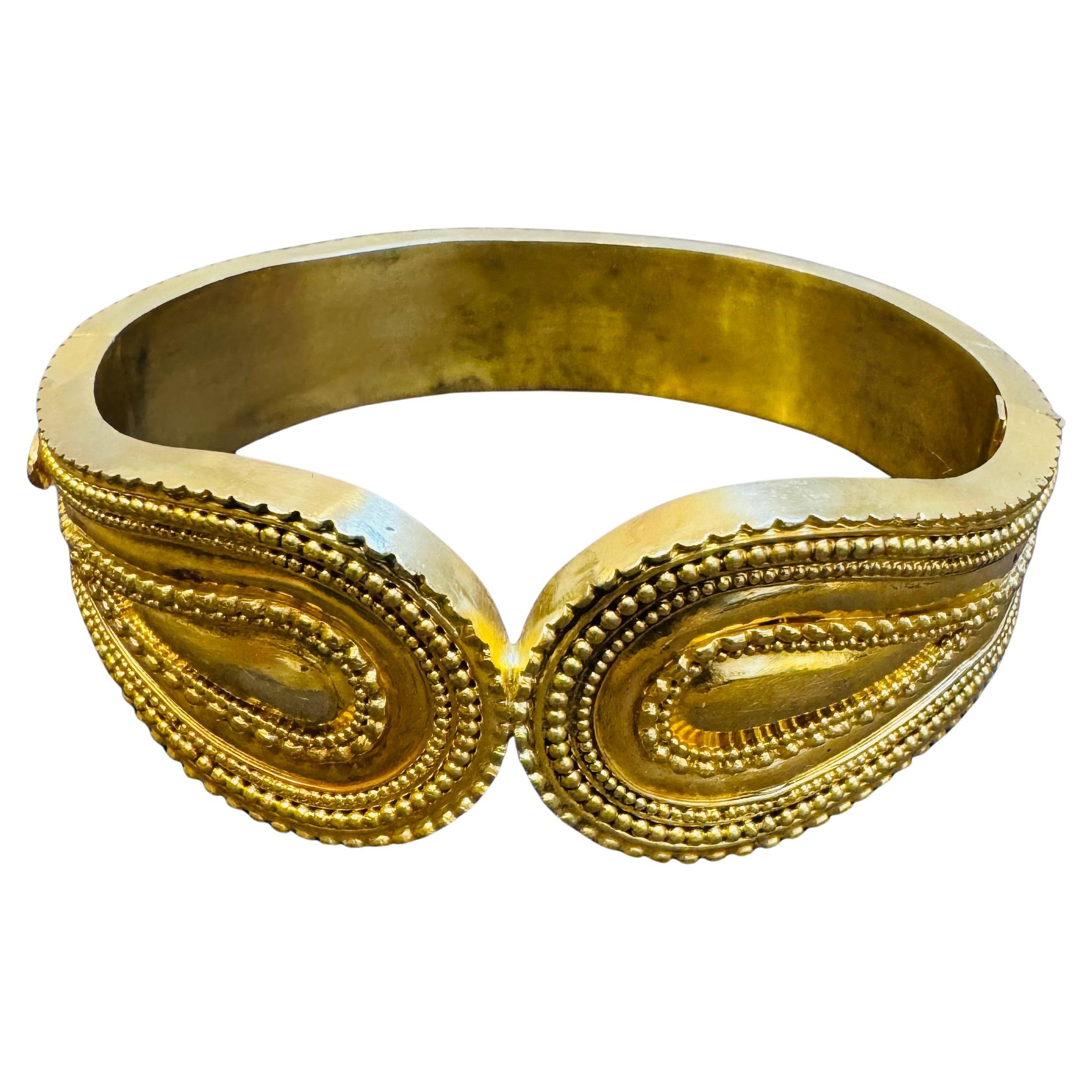 A spectacular jewelry piece from Designer Lalaounis
Estate Piece
Stamped 750 , 18 K , Greece and sign of Lalaounis
The bangle  is expertly crafted with 59.2 grams of  18 karat  Yellow gold  
Small to  Medium size bangle 

Authenticity and money back