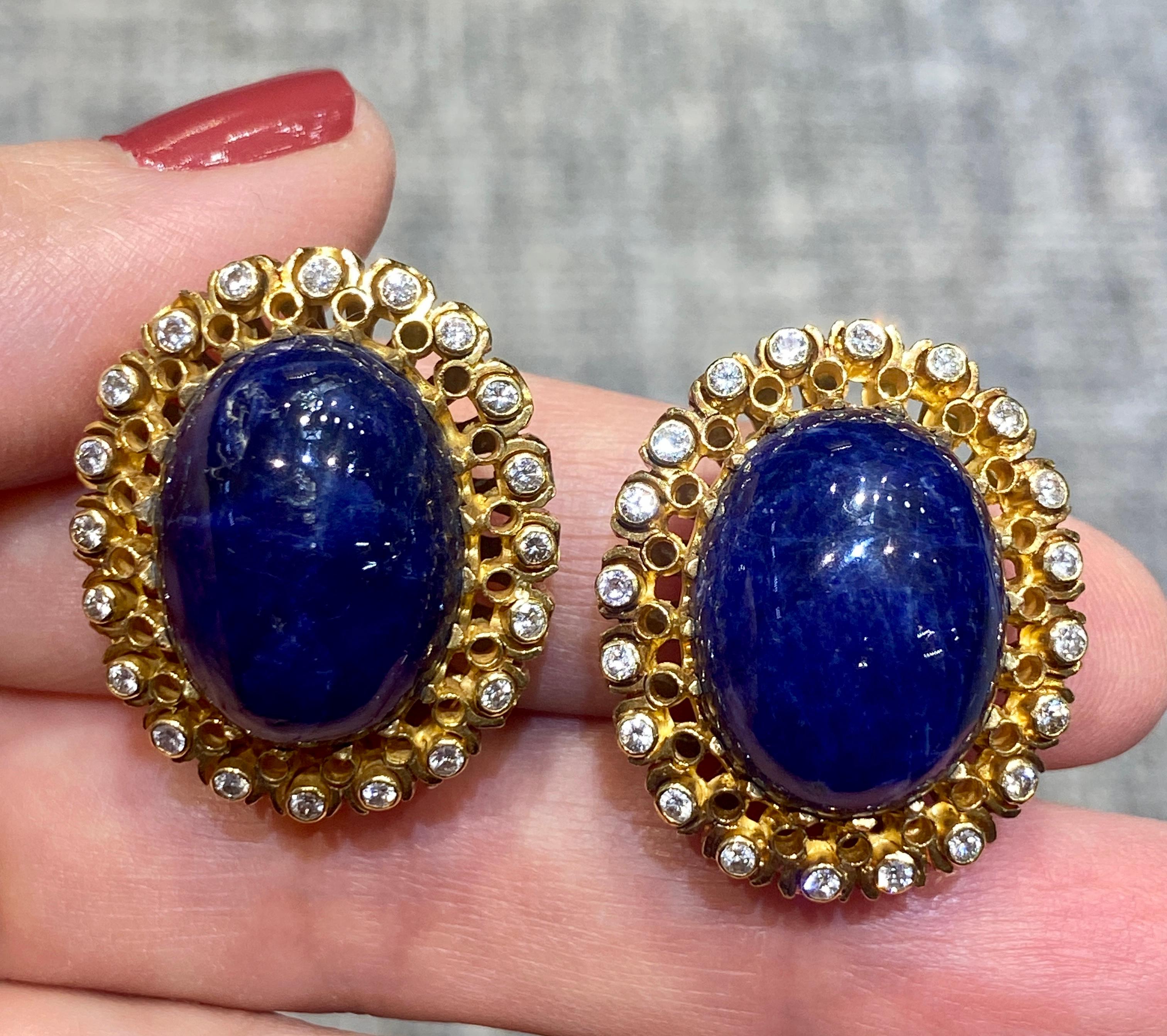 These beautiful 18k gold Lalaounis clip-on earrings consist of cabochon lapis lazuli surrounded by diamonds. The earrings are part of a set with a matching ring which is listed separately on 1st Dibs.