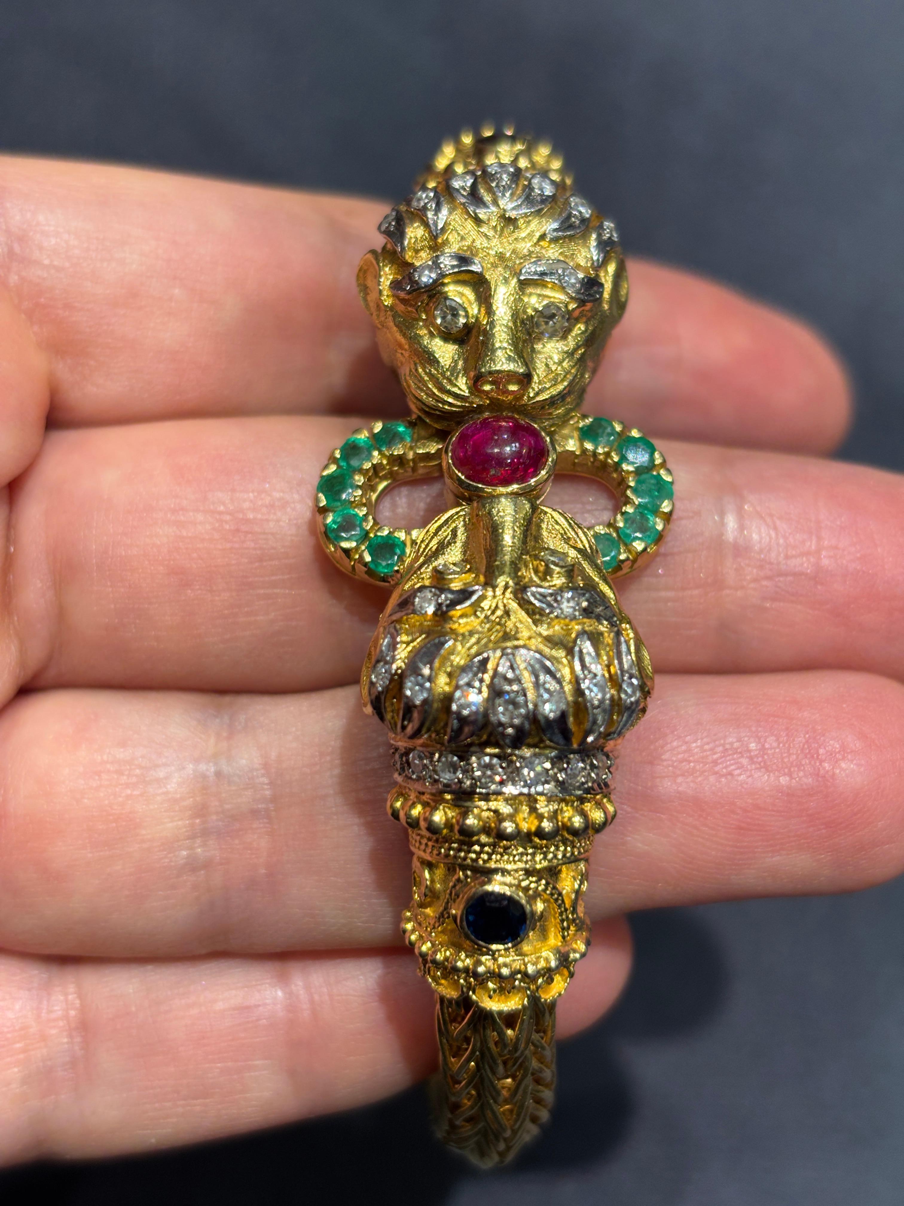 Contemporary Lalaounis 18k gold lion's head bangle with diamonds, rubies, emeralds, sapphires For Sale