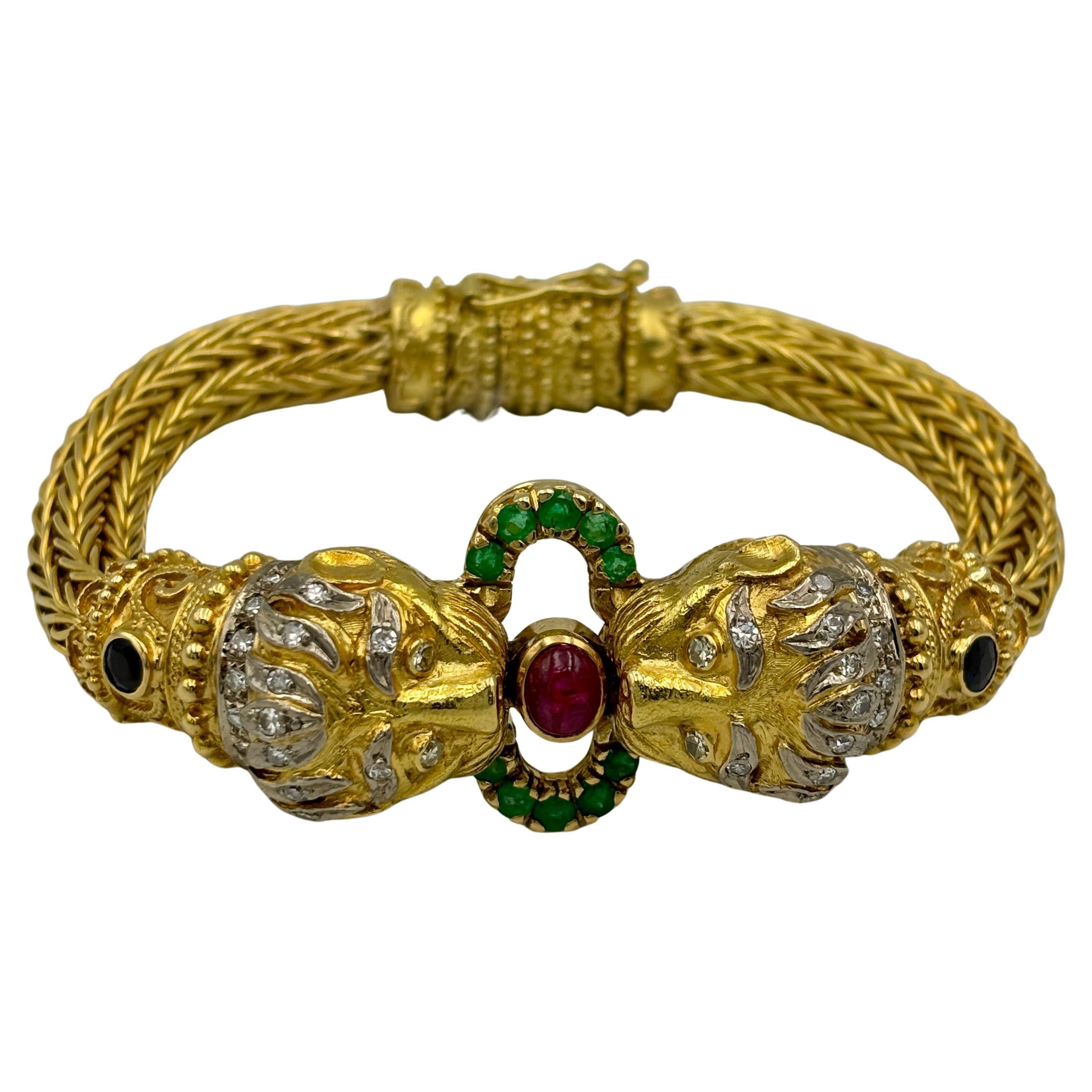 Lalaounis 18k gold lion's head bangle with diamonds, rubies, emeralds, sapphires