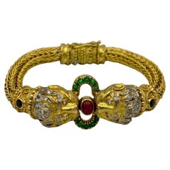 Lalaounis 18k gold lion's head bangle with diamonds, rubies, emeralds, sapphires