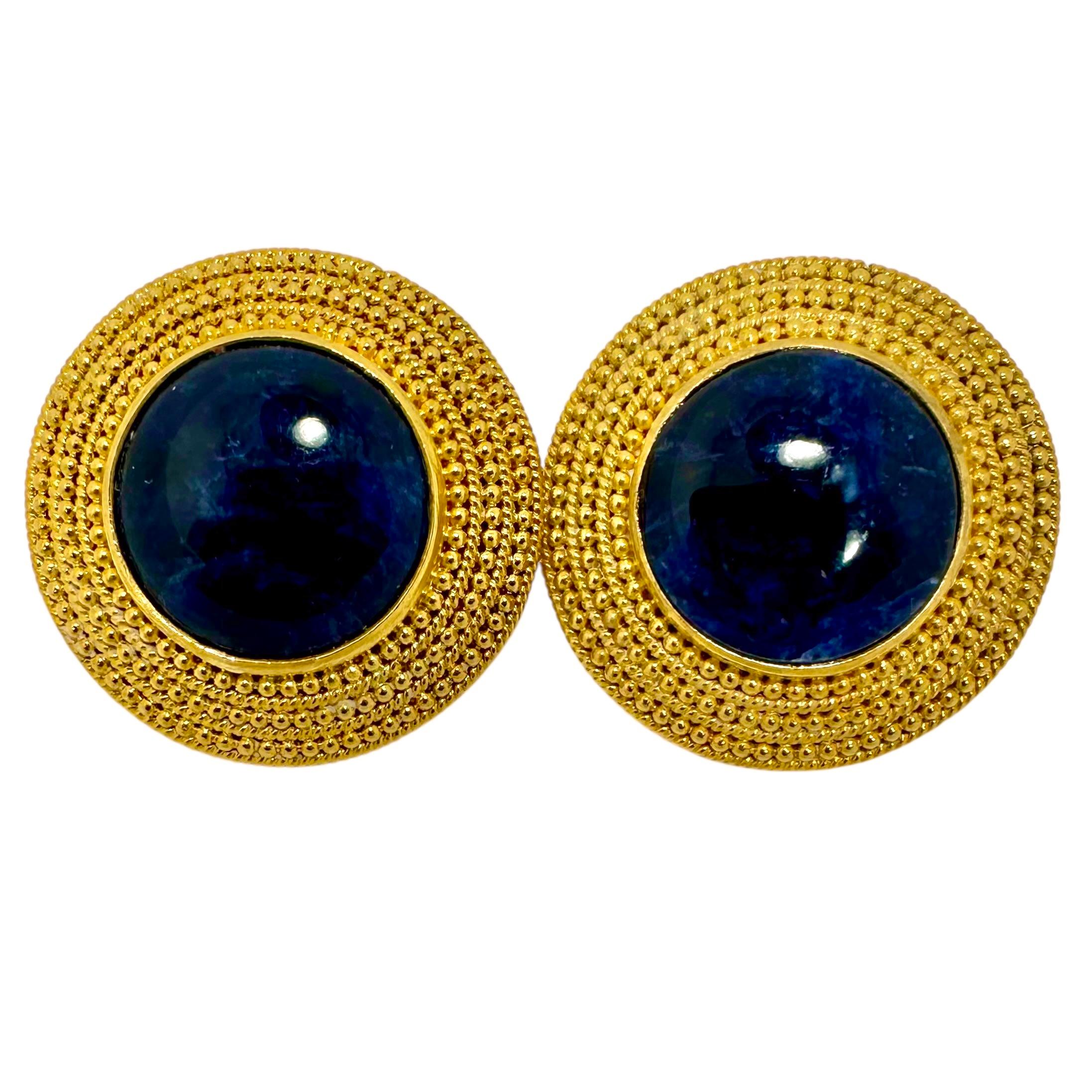 A classic, tailored pair of 18K yellow gold disc earrings by Greek designer Ilias Lalaounis. Measuring a little over one inch in diameter, they have a strong presence. Ideal for wearing to the office, out to lunch or dinner, as well as with casual
