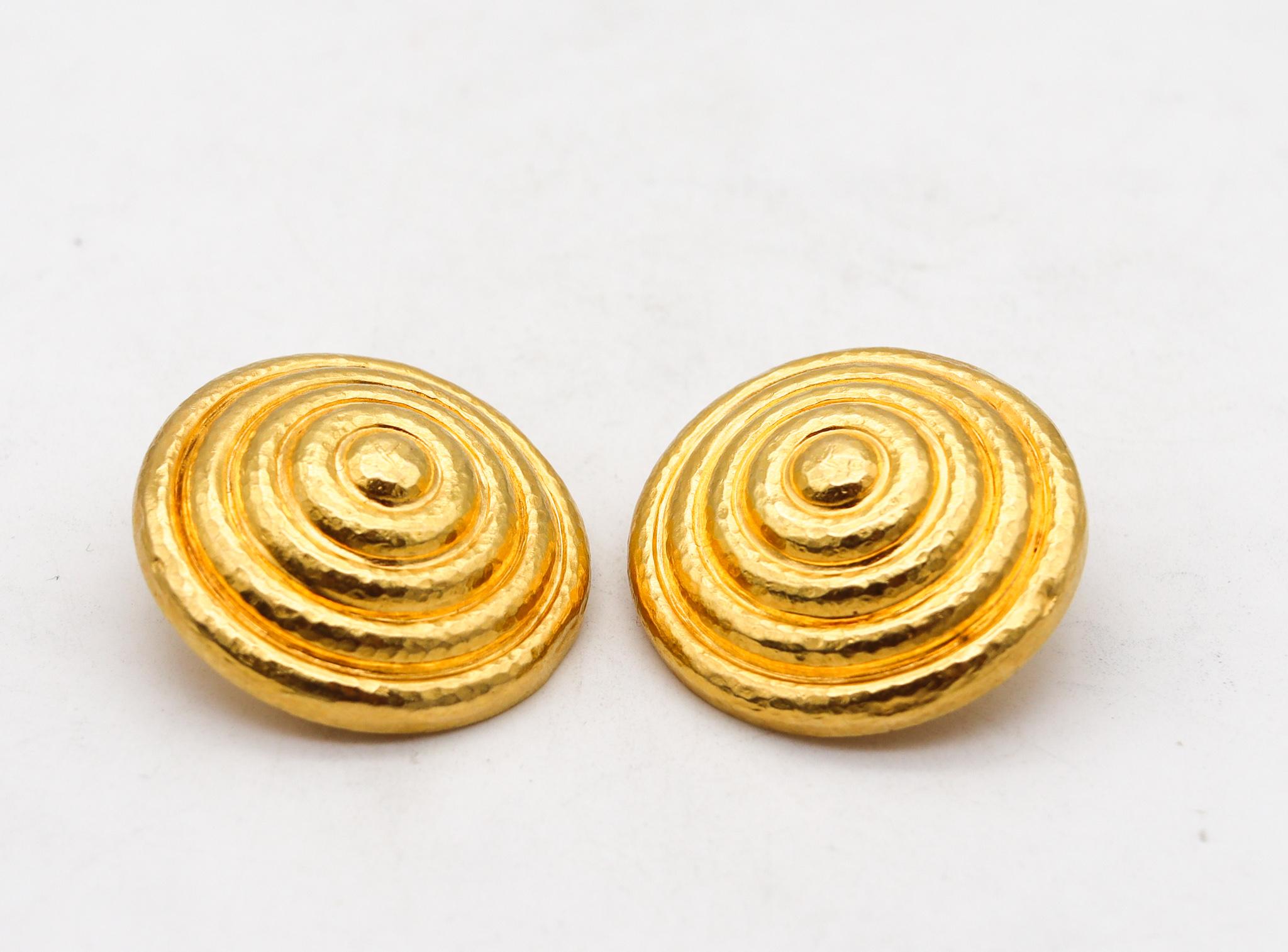 A pair of round Earrings designed by Ilias Lalaounis.

Beautiful statement round shield earrings, created in Greece by the jewelry house of Lalaounis back in the 1970's. These gorgeous vintage bold pair are part of the collection named Minoans and