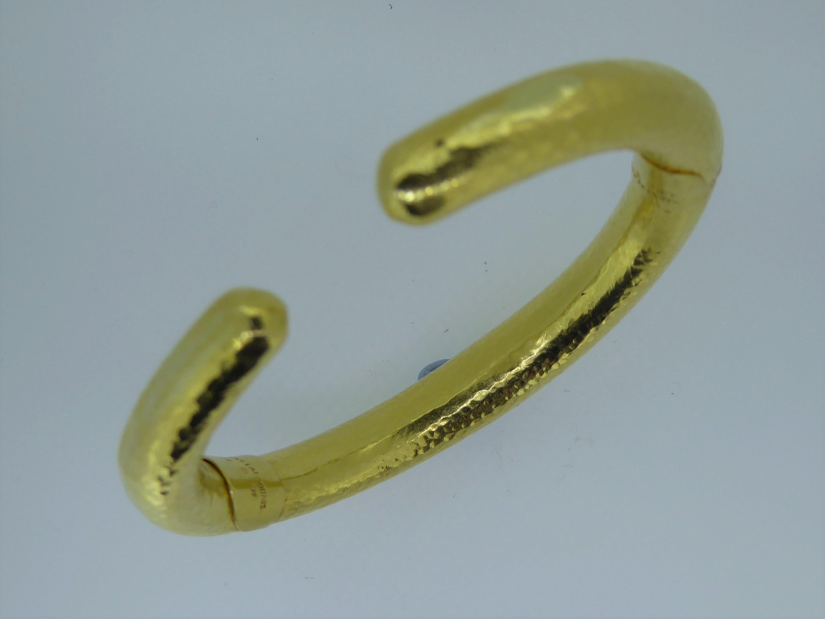 A Lalaounis 22 Carat Hammered Yellow Gold Double Hinged Bangle. Circa 1980. Stamped 