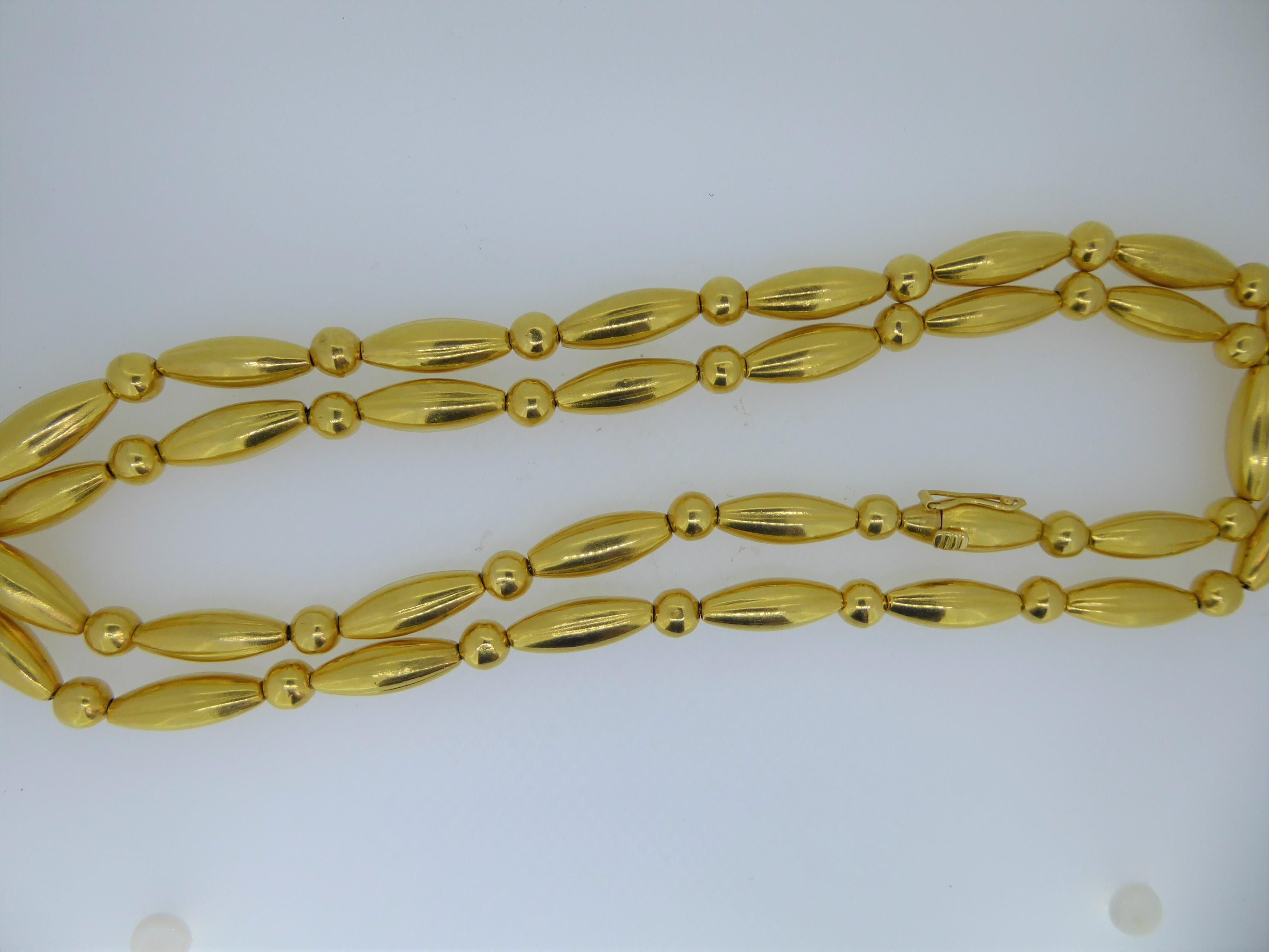 A Lalaounis 22 Carat Yellow Gold Bead Necklace. Circa 1970s. The alternating gold beads with 22ct hand-woven chain. Stamped 