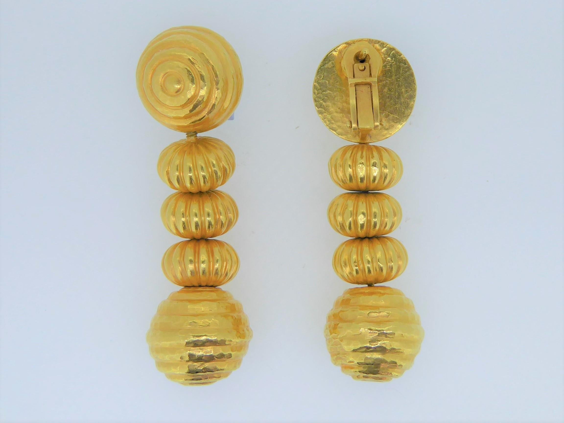 A Lalaounis 22 Carat Yellow Gold Minoan Bead Pendent Earrings. Circa 1970s. The 22ct hammered yellow gold bead earrings, each with removable drops. All on a beautiful and intricate 22ct hand-woven chain. Each earring stamped 